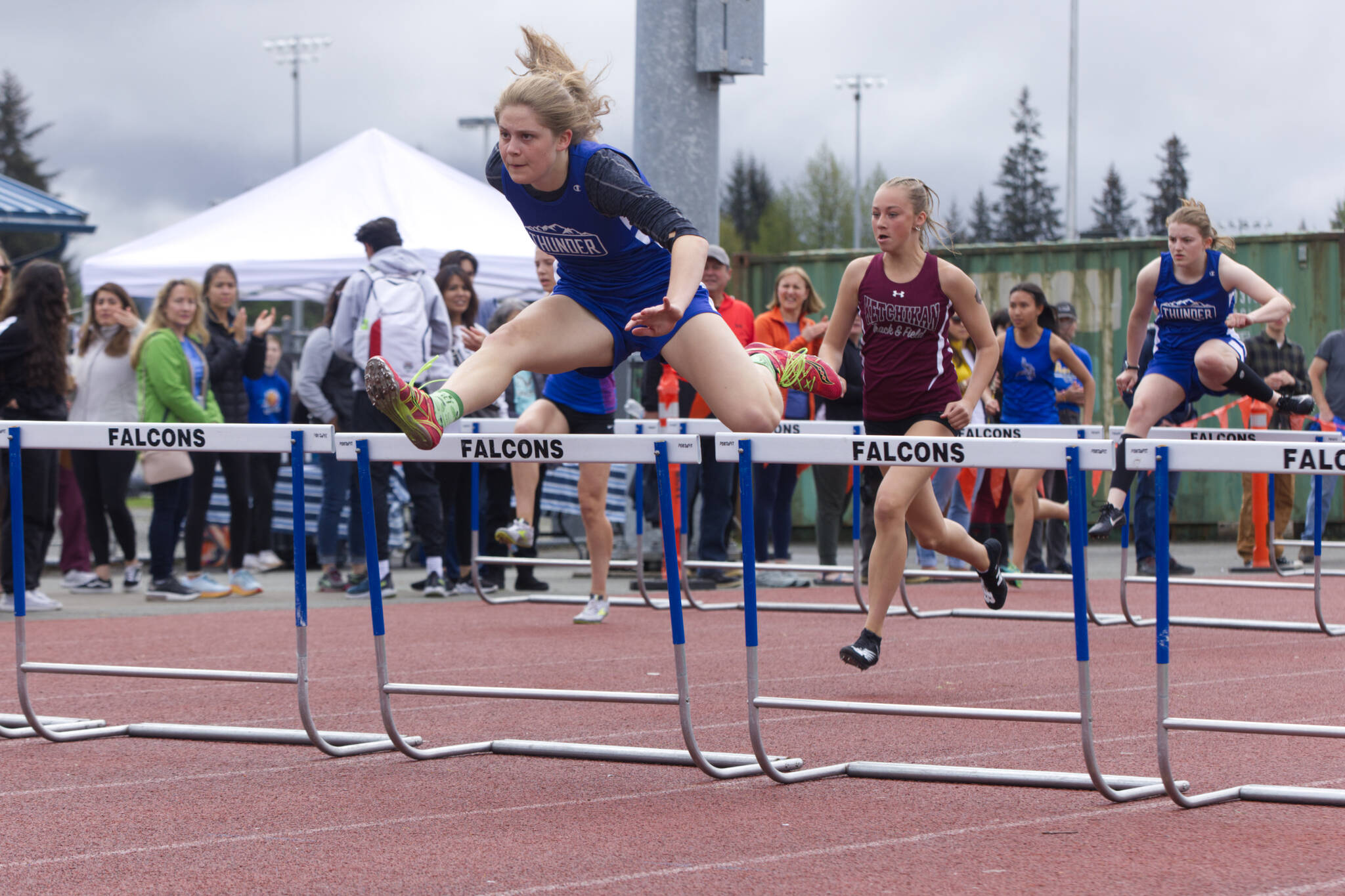 Thunder Mountain High School senior Mallory Welling leads the way in the girls 100-meter hurdles Saturday at TMHS. Welling finished with a time of 15.81 seconds. (Ben Hohenstatt / Juneau Empire)