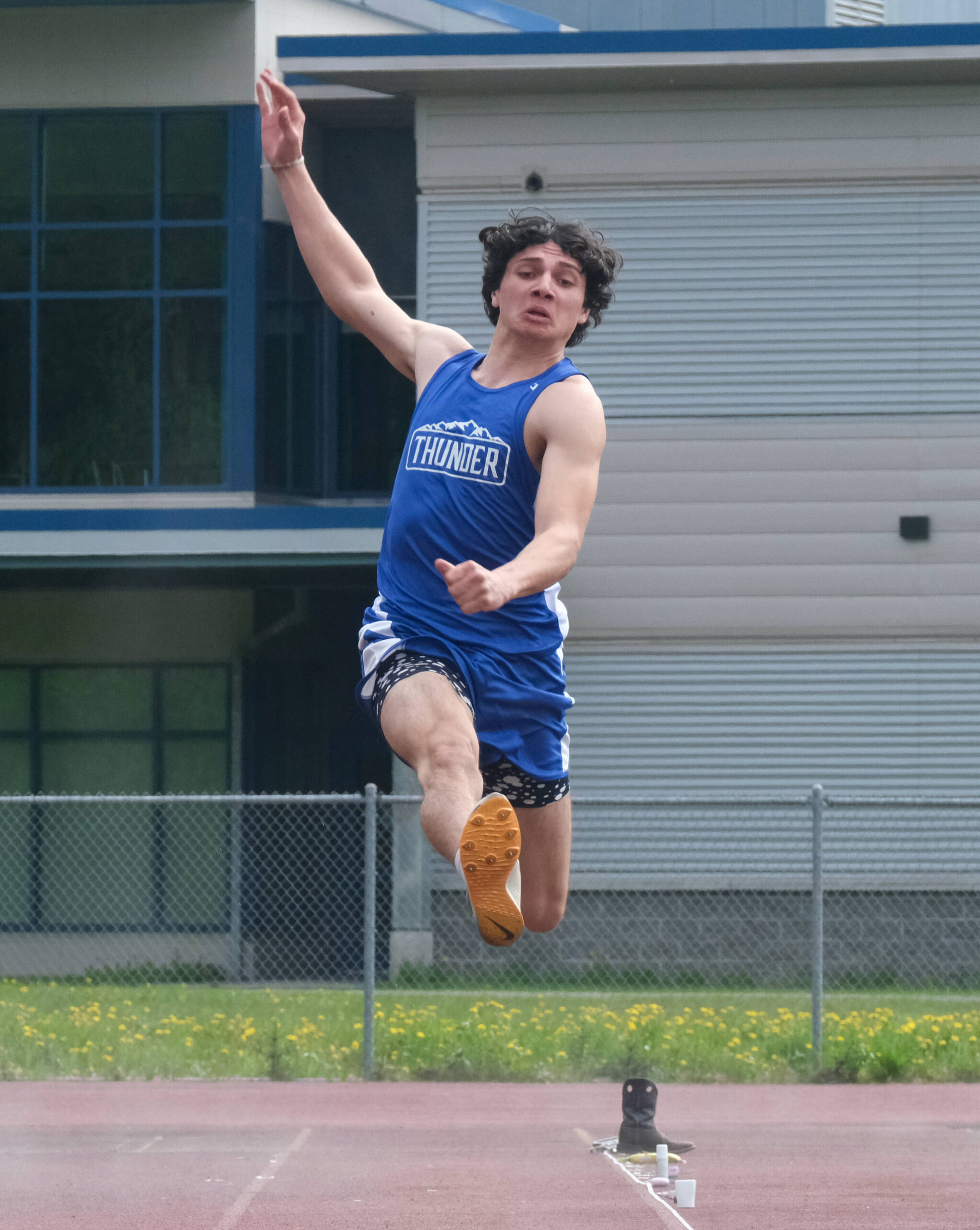 Thunder Mountain High School senior Chase Darbonne wins the Division I boys long jump during the Region V Track & Field Championships, Saturday, at TMHS. (Klas Stolpe / Juneau Empire)