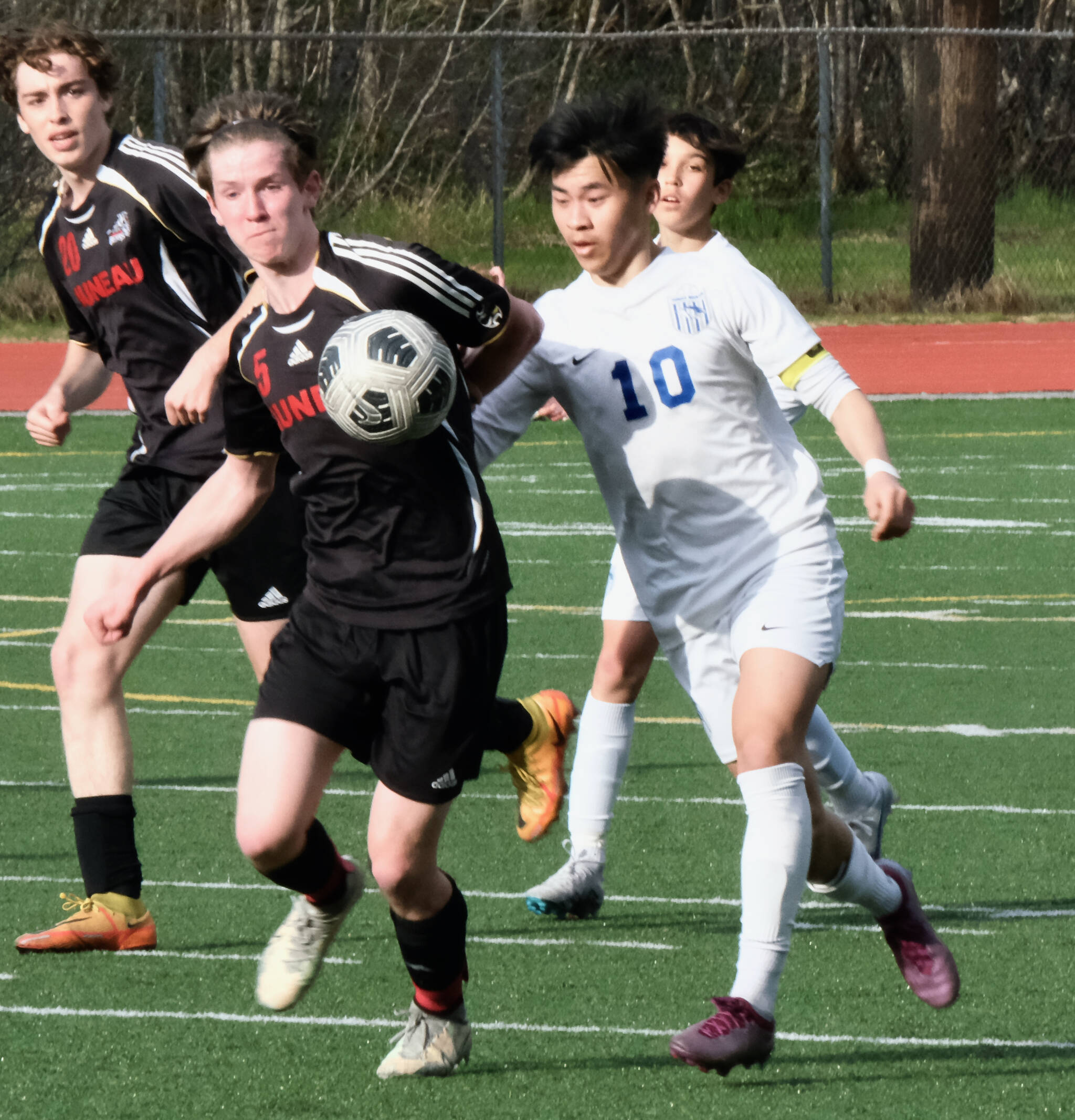 Thunder Mountain High School senior captain Preston Lam (10), shown in early season action against JDHS senior Kean Buss (5), was credited by coaches for defensive play at West Anchorage last weekend. (Klas Stolpe / Juneau Empire File)