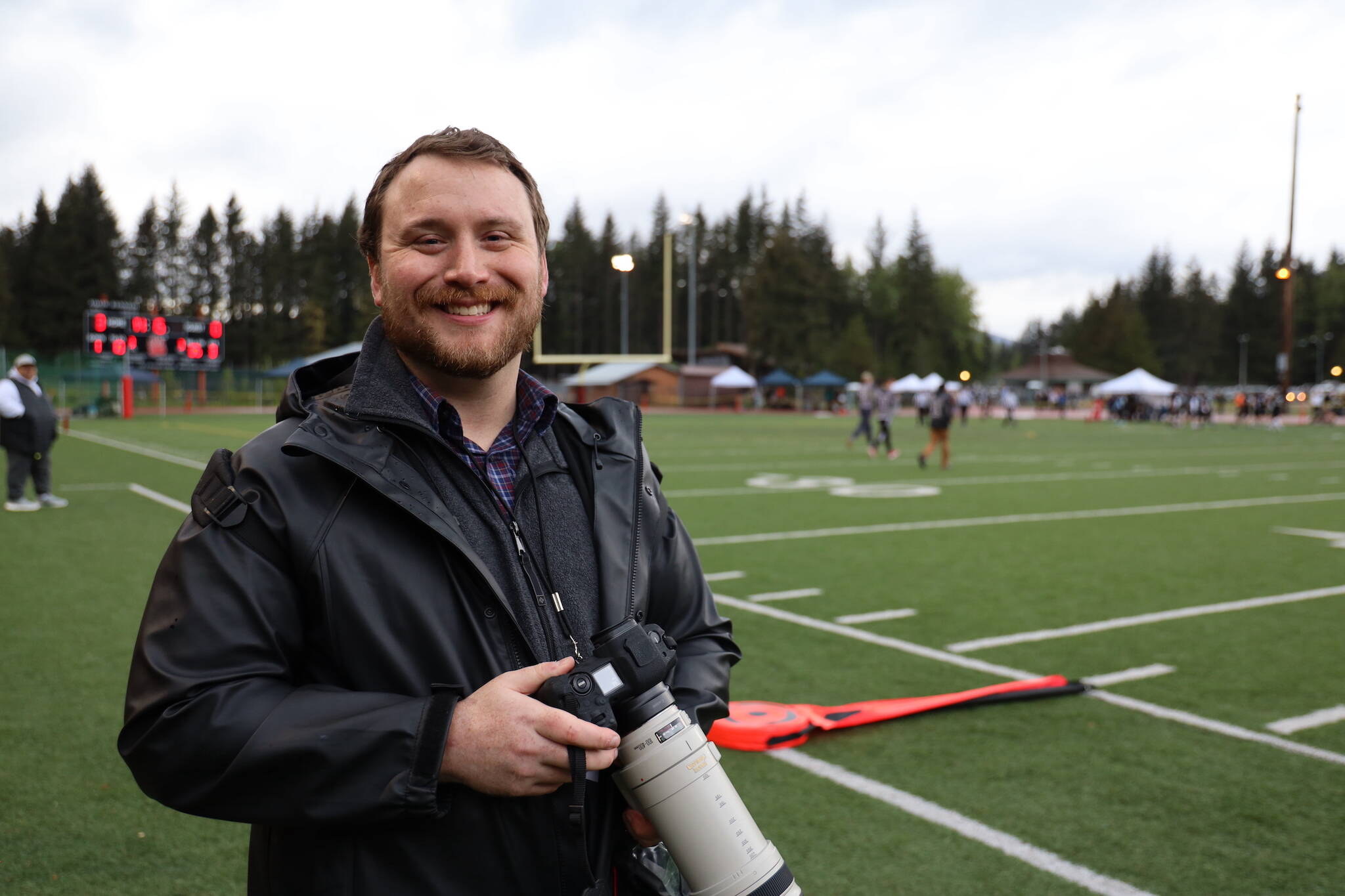 Juneau Empire Managing Editor Ben Hohenstatt takes photos at the Juneau Alumni Football game on Friday at Adair-Kennedy Memorial Park. Hohenstatt is departing after five years to accept a job with the Alaska State Ombudsman. (Clarise Larson / Juneau Empire)