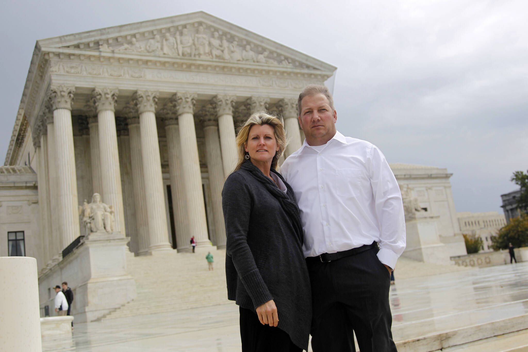 Michael and Chantell Sackett of Priest Lake, Idaho, pose for a photo in front of the Supreme Court in Washington on Oct. 14, 2011. The Supreme Court on Thursday, May 25, 2023, made it harder for the federal government to police water pollution in a decision that strips protections from wetlands that are isolated from larger bodies of water. The justices boosted property rights over concerns about clean water in a ruling in favor of an Idaho couple who sought to build a house near Priest Lake in the state’s panhandle. (AP Photo/Haraz N. Ghanbari, File)