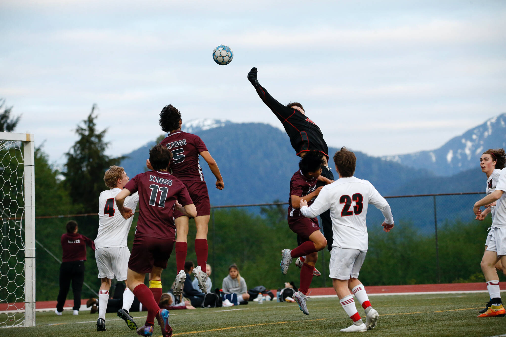 In this May 19 photo, Juneau-Douglas’s keeper Alex Mallott deflects the ball during Kayhi’s 1-0 victory over Juneau-Douglas at Fawn Mountain. Photo by Christopher Mullen Ketchikan Daily News