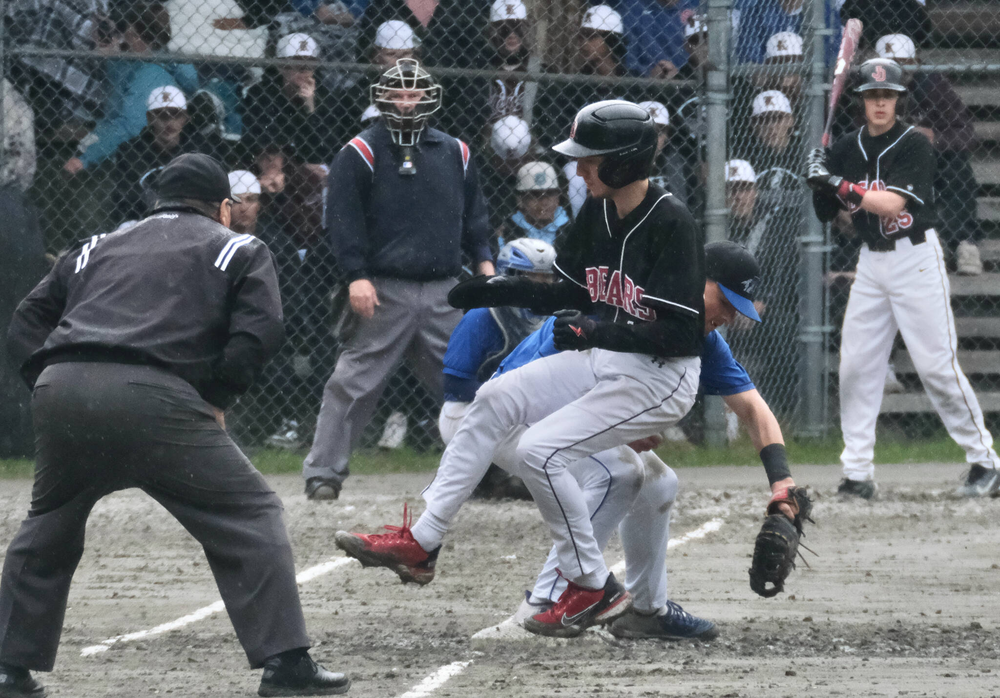 Juneau-Douglas base runner Brandon Casperson gets safely back to first base before Thunder Mountain first baseman Rory Hayes applies the tag during the Crimson Bears 11-6 win over the Falcons to open the Region V Tournament, Thursday, at Adair Kennedy Field. (Klas Stolpe / Juneau Empire)