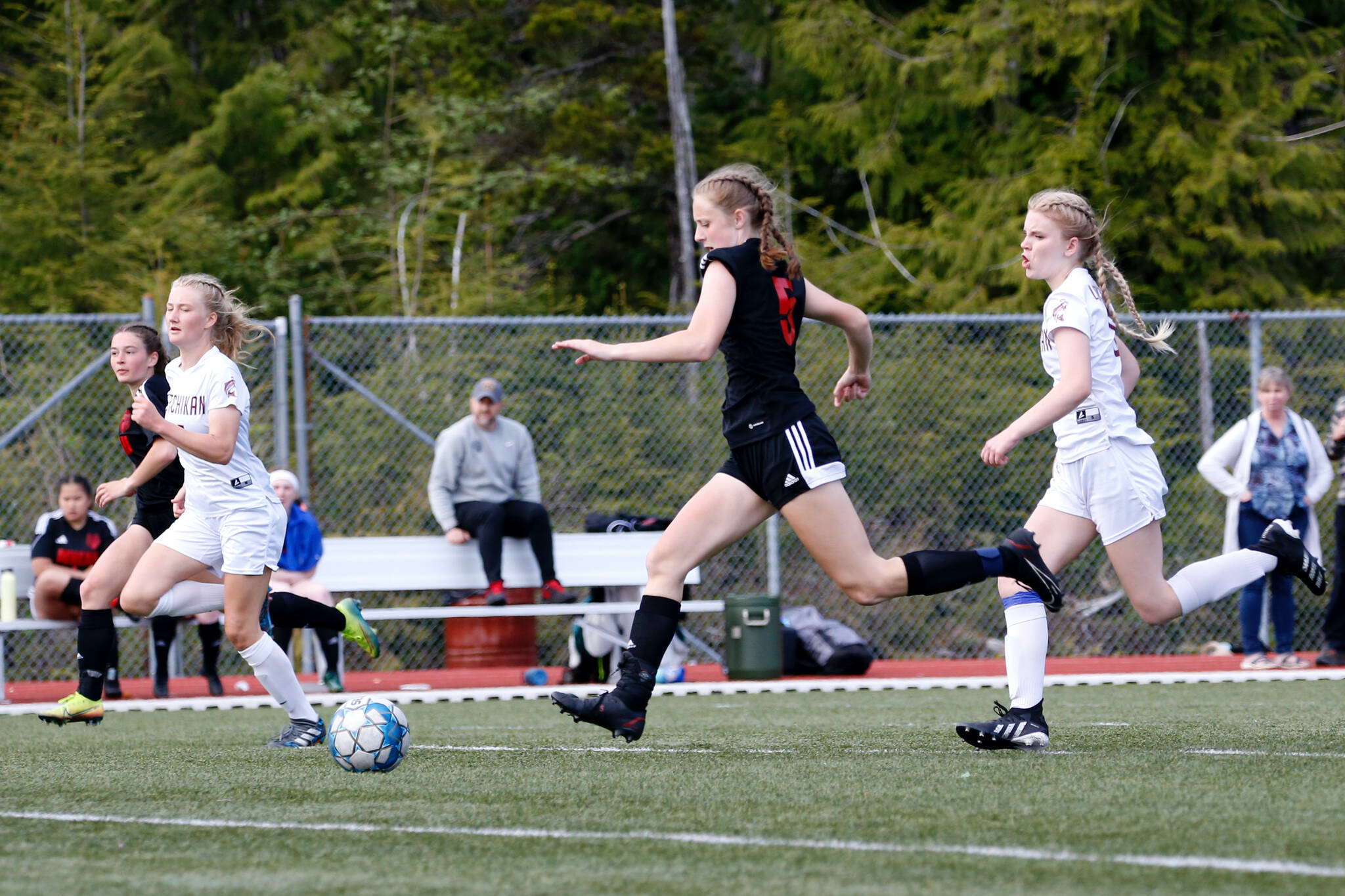 In this file photo from last week Juneau Douglas’s Peyton Wheeler (5) runs downfield with the ball during Juneau-Douglas and Kayhi’s 1-1 tie at Fawn Mountain. JDHS fell to Kenai in the state semifinals 2-0 on Friday. (Courtesy Photo / Christopher Mullen, Ketchikan Daily News)