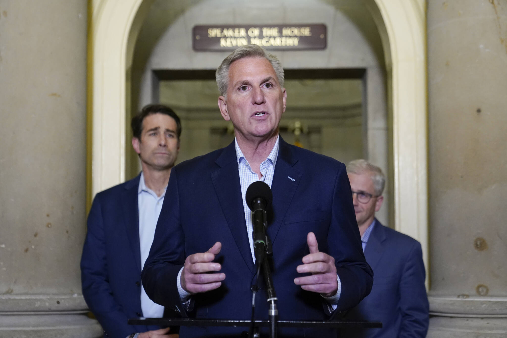 House Speaker Kevin McCarthy of Calif., speaks during a news conference after President Joe Biden and McCarthy reached an “agreement in principle” to resolve the looming debt crisis on Saturday, May 27, 2023, on Capitol Hill in Washington. Rep. Patrick McHenry, R-N.C., a key Republican in the debt limit negotiations and chairman of the House Financial Services Committee, back right, and Rep. Garret Graves, R-La., McCarthy’s top mediator in the debt limit talks, left, look on. (AP Photo / Patrick Semansky)