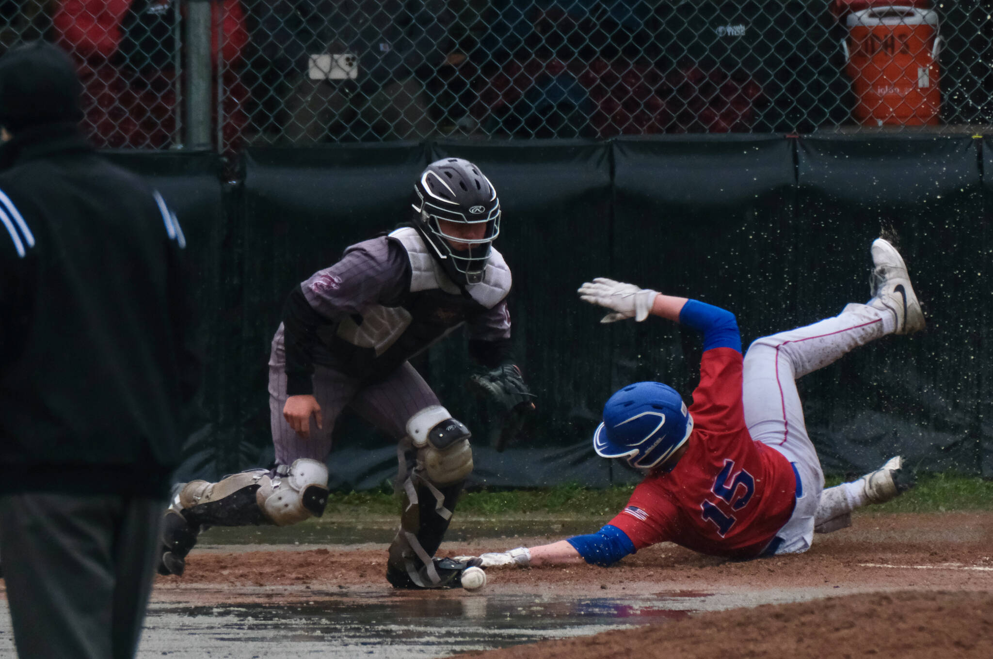 Sitka junior Grady Smith slides safely into home plate during the Wolves 13-7 win over the Ketchikan Kings for the Region V Baseball Championship, Saturday, at Adair Kennedy Field (Klas Stolpe / Juneau Empire)