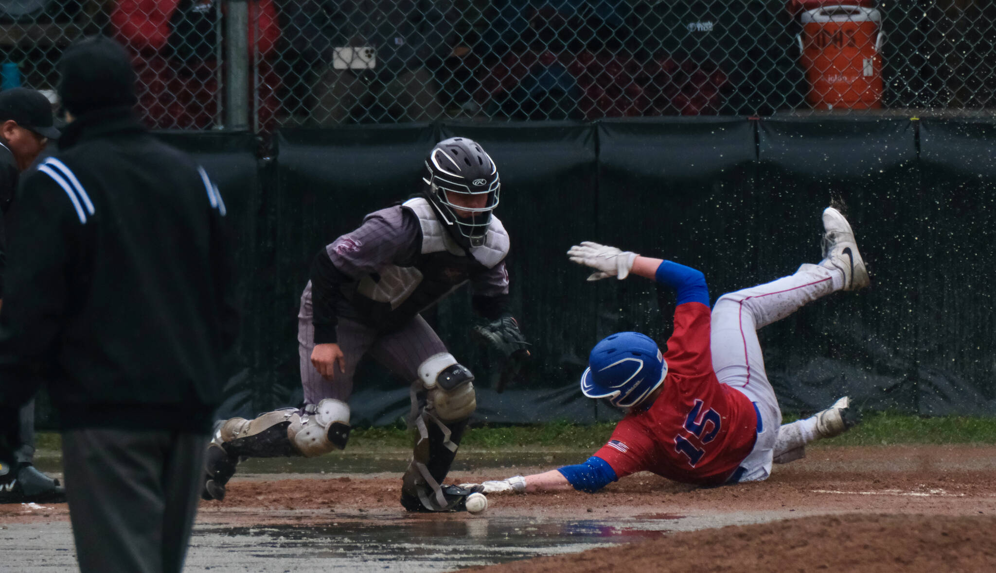 Sitka junior Grady Smith slides safely into home plate during the Wolves 13-7 win over the Ketchikan Kings for the Region V Baseball Championship on Saturday at Adair Kennedy Field (Klas Stolpe / Juneau Empire)