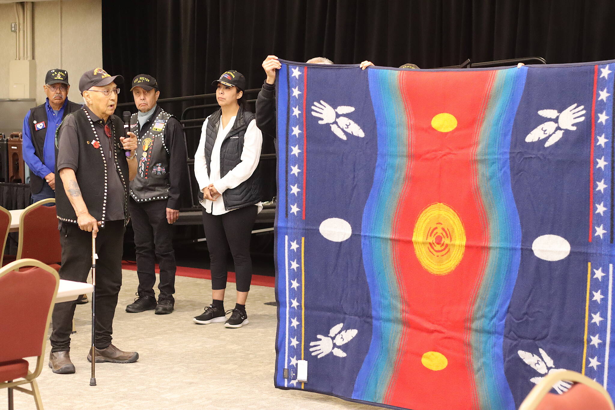Ray Wilson, who served in the Army during the Korean War, explains the Warriors Circle of Honor Blanket he received last year as a tribute on his 90th birthday during the Southeast Alaska Native Veterans Memorial Day observance at Elizabeth Peratrovich Hall on Monday. (Mark Sabbatini / Juneau Empire)