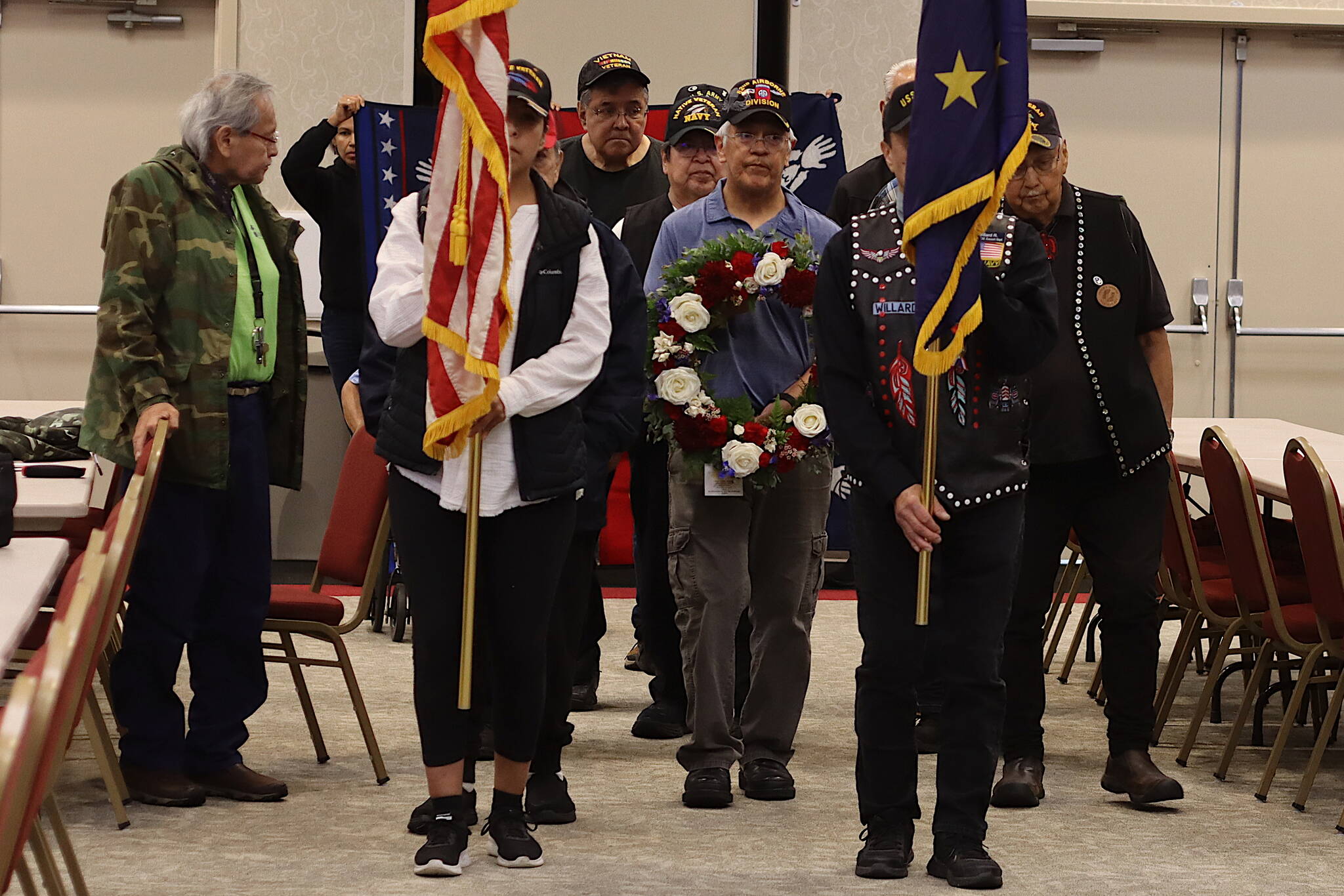A color guard of Southeast Alaska Native Veterans carries flags to the stage at Elizabeth Peratrovich Hall during a Memorial Day commemoration Monday. (Mark Sabbatini / Juneau Empire)