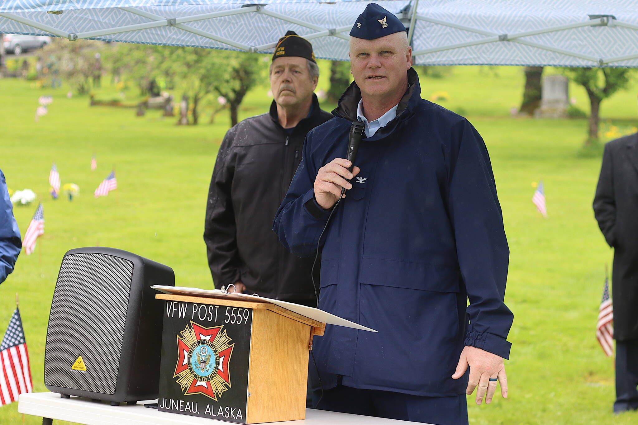 Capt. Darwin Jensen, commander of U.S. Coast Guard Sector Juneau, gives a speech to veterans and others gathered for a Memorial Day observance at Evergreen Cemetery on Monday. (Mark Sabbatini / Juneau Empire)