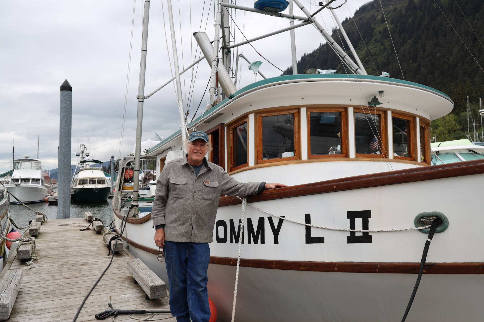 Longtime Juneau resident Joe Emerson, co-owner of the F/V Tommy L II berthed in Aurora Harbor, smiles for a photo next to his boat in late May. Emerson is one of the hundreds of trollers in Southeast Alaska that will be directly impacted by a federal court order that may force the closure of the region’s king salmon troll fishery set to begin July 1. (Clarise Larson / Juneau Empire)