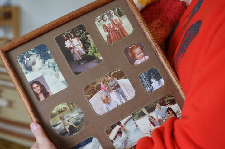 Faith Rogers' younger sister Michelle Rogers holds a photo collage of Faith that hung on the wall in their family home in September 2022. A readiness hearing was held Wednesday for Anthony Michael Migliaccio, who was indicted in late November 2022 on two counts of second-degree murder and a charge of manslaughter. (Clarise Larson / Juneau Empire)
