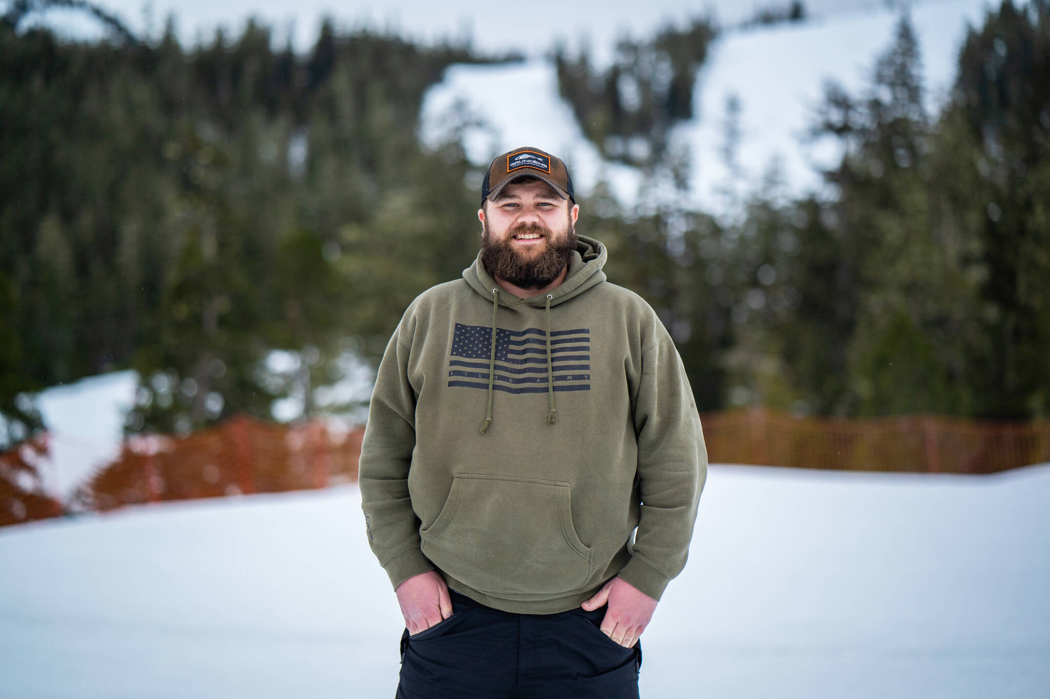 Ben Bullock, outdoor education program coordinator for Douglas Indian Association, stands at the base of Eaglecrest Ski Area, where he typically spends his day coordinating Snow Camp alongside volunteers, chaperones and Eaglecrest staff.
