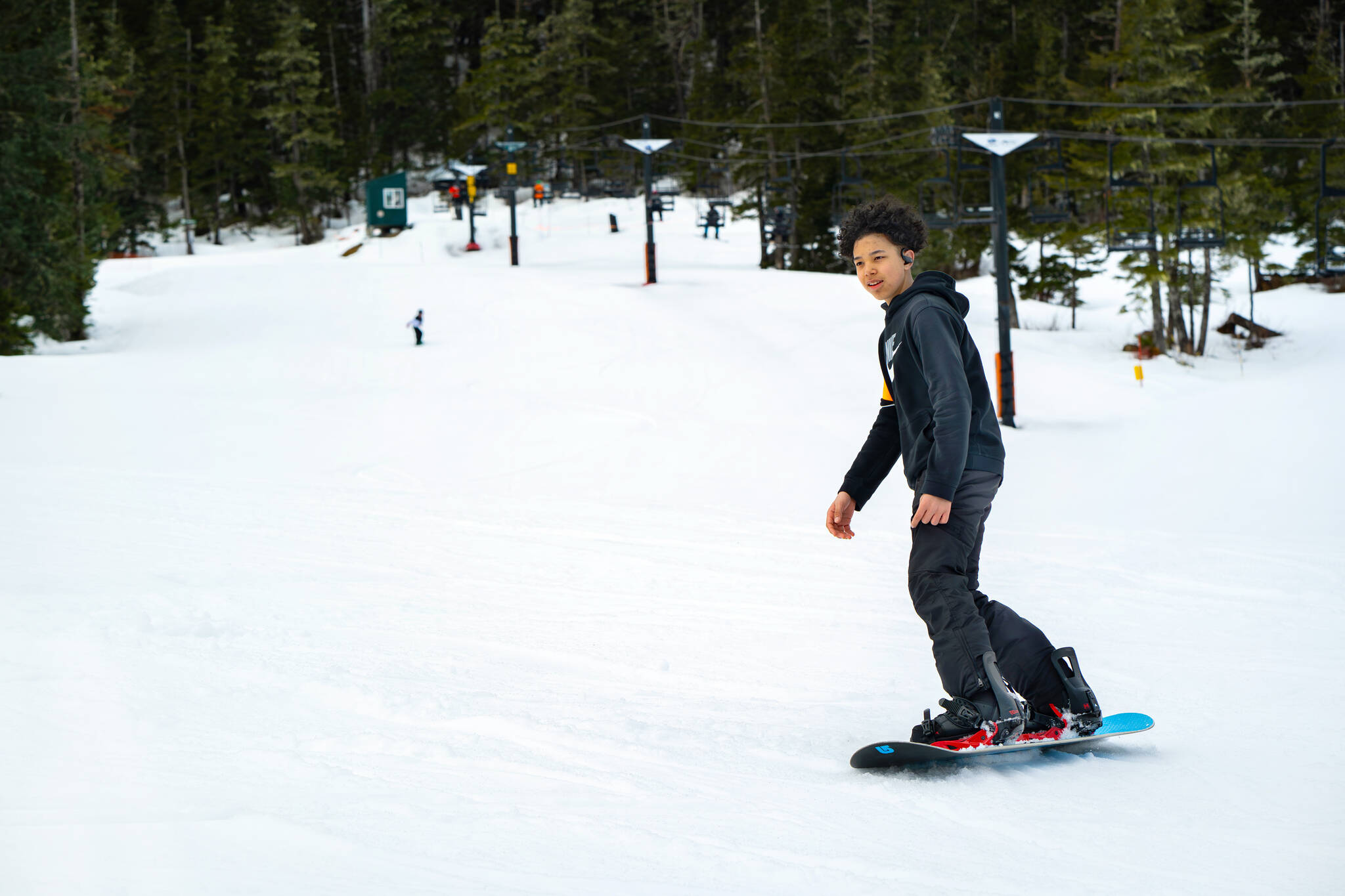 Wyatt Miramontes makes a turn down the Dolly Varden run where most participants begin their journey learning to ski and snowboard at Snow Camp with lessons through Eaglecrest Snowsports School. (Photo by Lee House / Sitka Conservation Society)