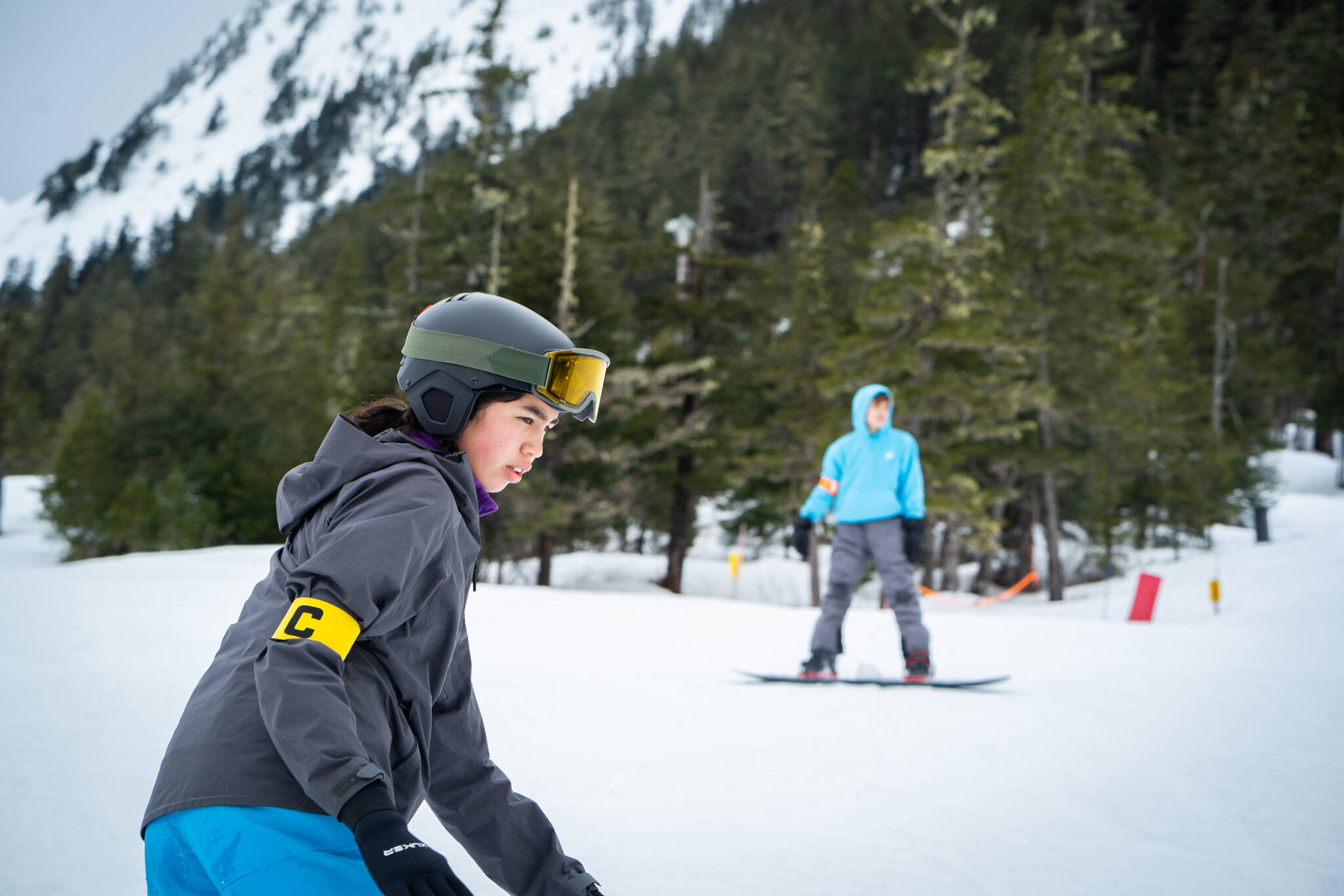 Aliyah Merculief focuses on her run while snowboarding at Snow Camp. (Photo by Lee House / Sitka Conservation Society)