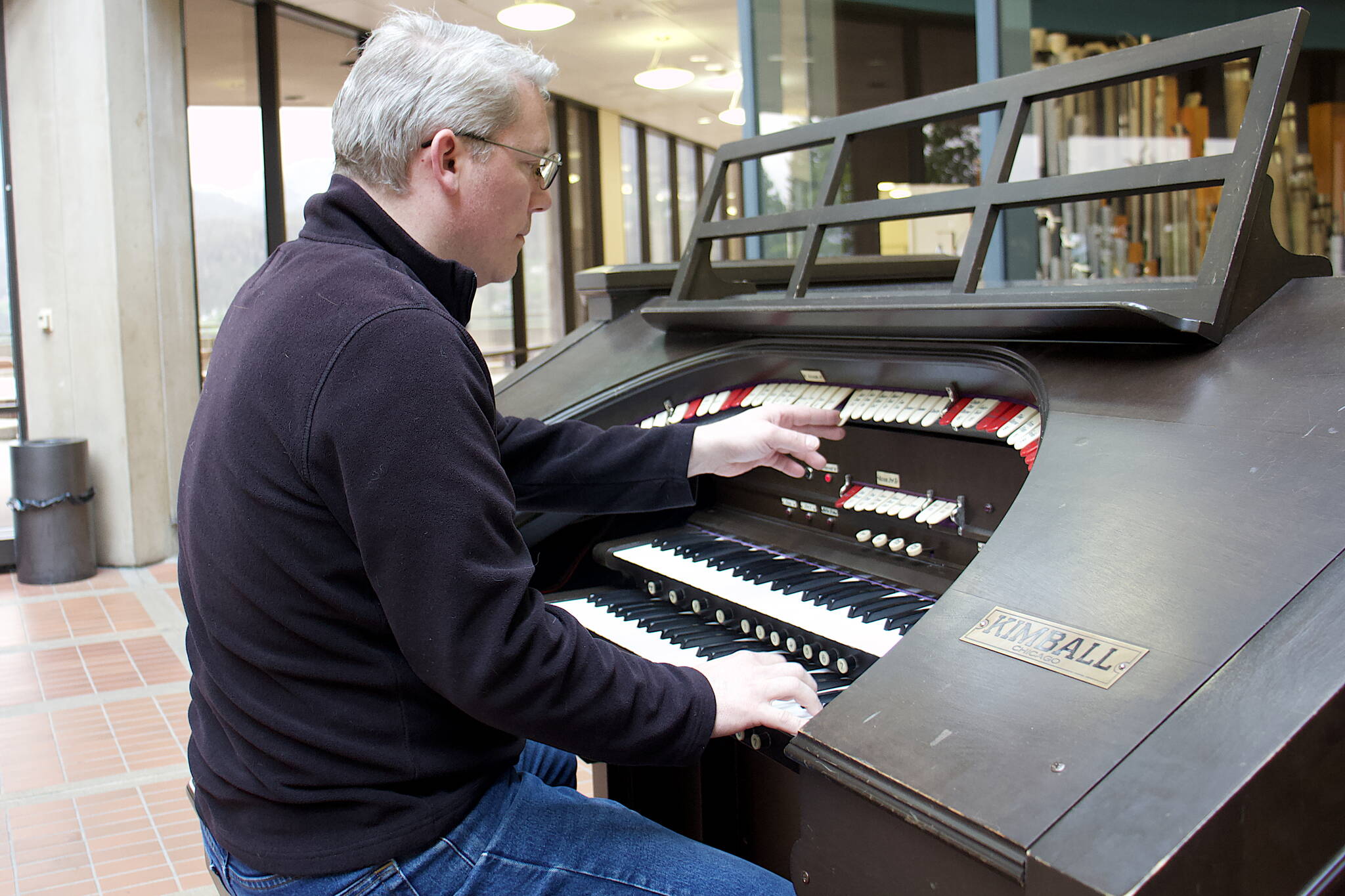 Mark Sabbatini / Juneau Empire
Christopher Nordwall plays a test song on the 1928 Kimball Theatre Pipe Organ in the State Office Building on Tuesday.