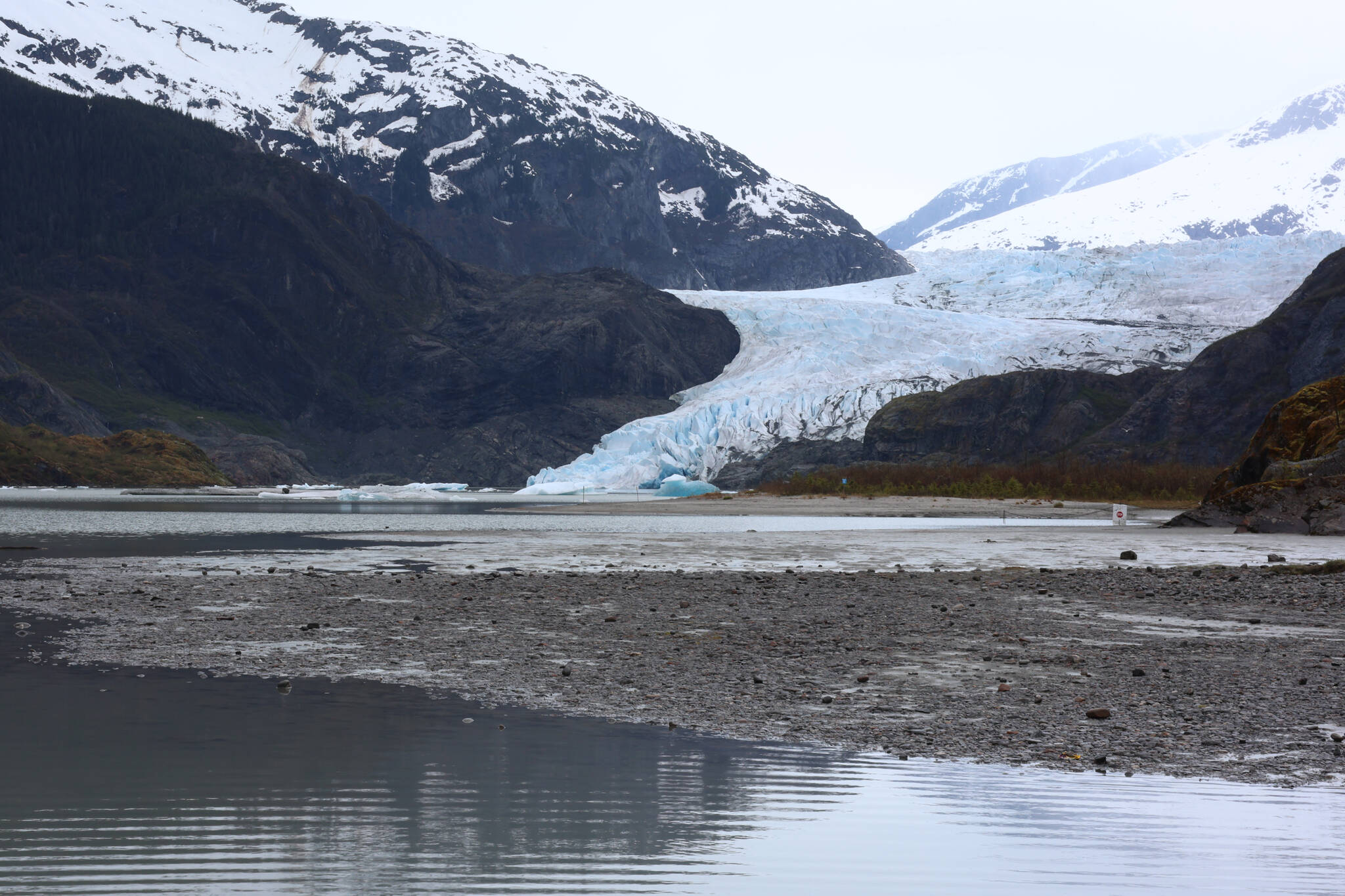 The Mendenhall Glacier and surrounding area is seen under an overcast sky on May 12. A federal order published Friday bans mineral extraction activities such as mining in an expanded area of land surrounding the glacier for the next 20 years. (Ben Hohenstatt / Juneau Empire File)