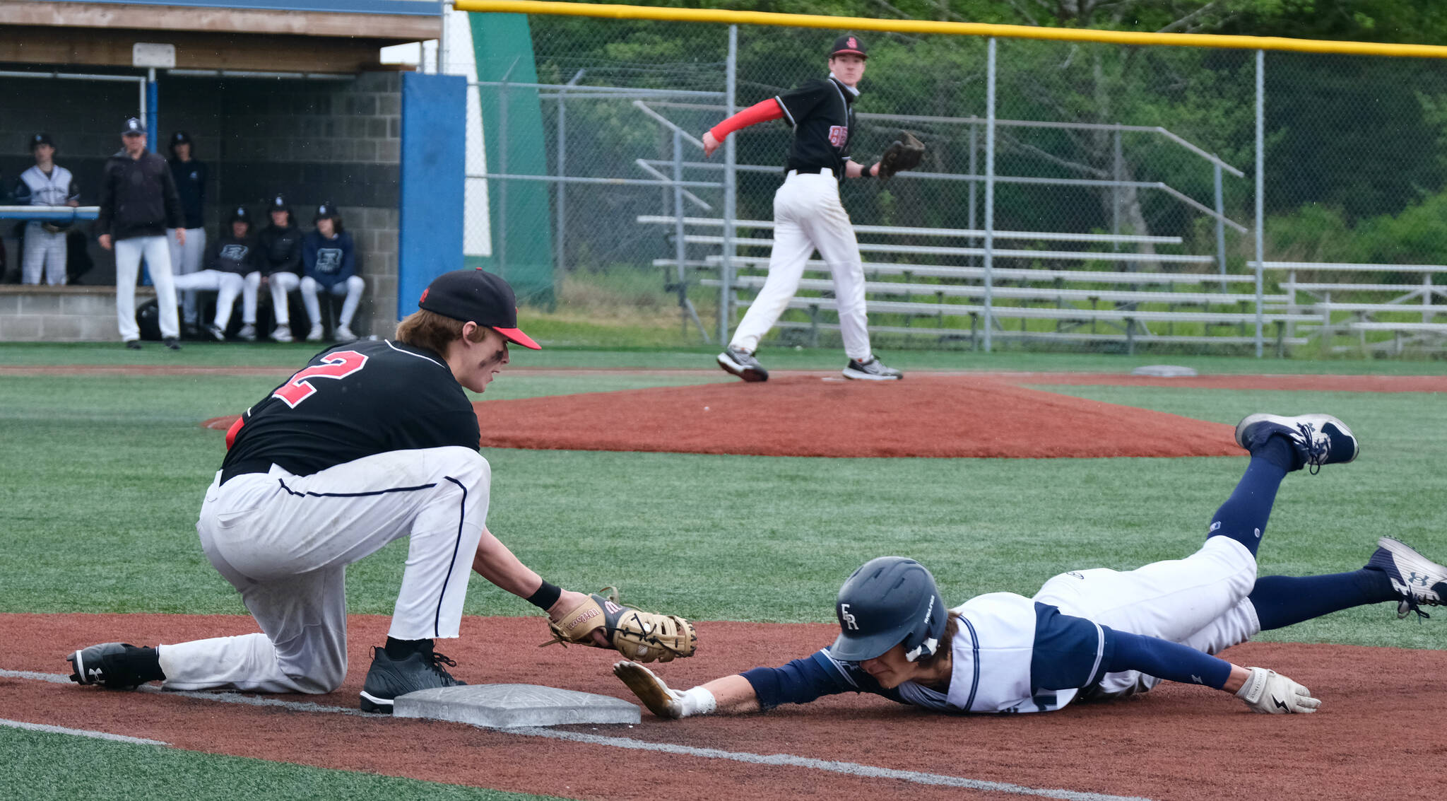 JDHS senior first baseman Bodhi Miller tags out Eagle River junior base runner Gunner Mountcastle on a pick off move from pitcher Eli Crupi during the Crimson Bears 2-1 loss to the Wolves in an elimination game Friday at the ASAA Division I State Baseball Championships on Sitka’s Moller Field. (Klas Stolpe / Juneau Empire)