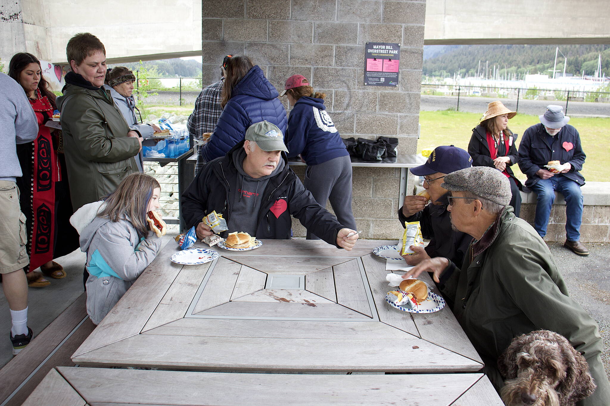 Local residents from a diverse range of ages and cultures gather for a cookout Sunday at Bill Overstreet Park after participating in an annual walk celebrating National Cancer Survivors Day. (Mark Sabbatini / Juneau Empire)