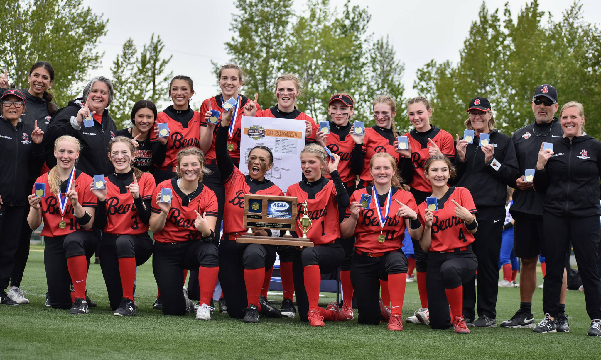 The JDHS Crimson Bears pose with their championship trophy after defeating the Sitka Wolves 6-5 on Saturday for the ASAA Division II State Softball Championship at Anchorage’s Cartee Fields. (Courtesy Photo /JDHS Softball)