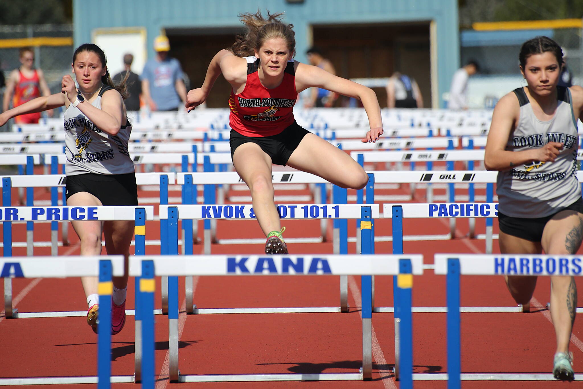 TMHS senior Mallory Welling, running for team North/Southeast, competes in the 100 hurdles at the Brian Young Invitational on Saturday in Kodiak. (Photo courtesy Brandi Adams)