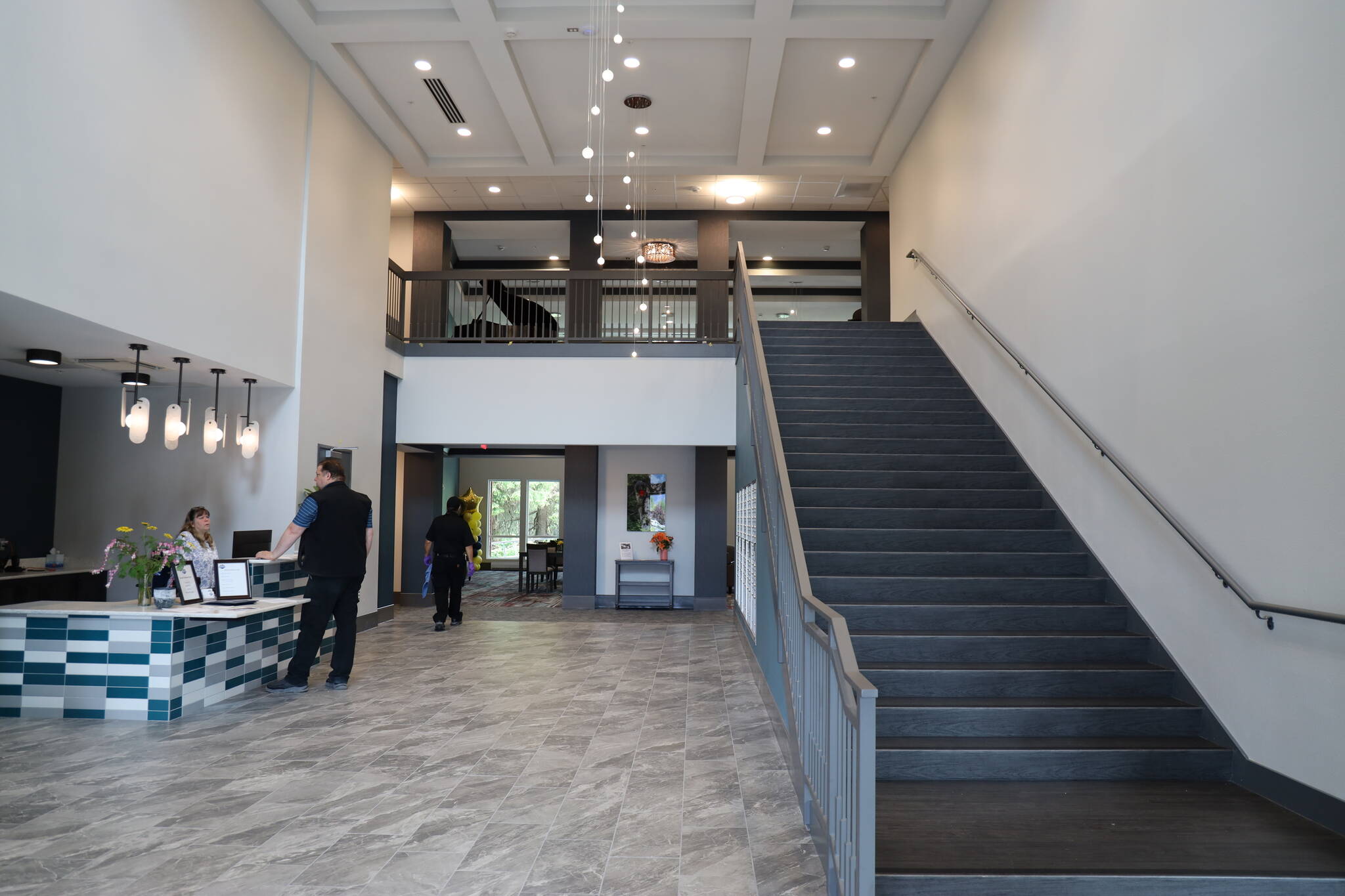 The entrance lobby of the Riverview Senior Living complex leads to a variety of in-house facilities including dining and recreation areas. (Clarise Larson / Juneau Empire)