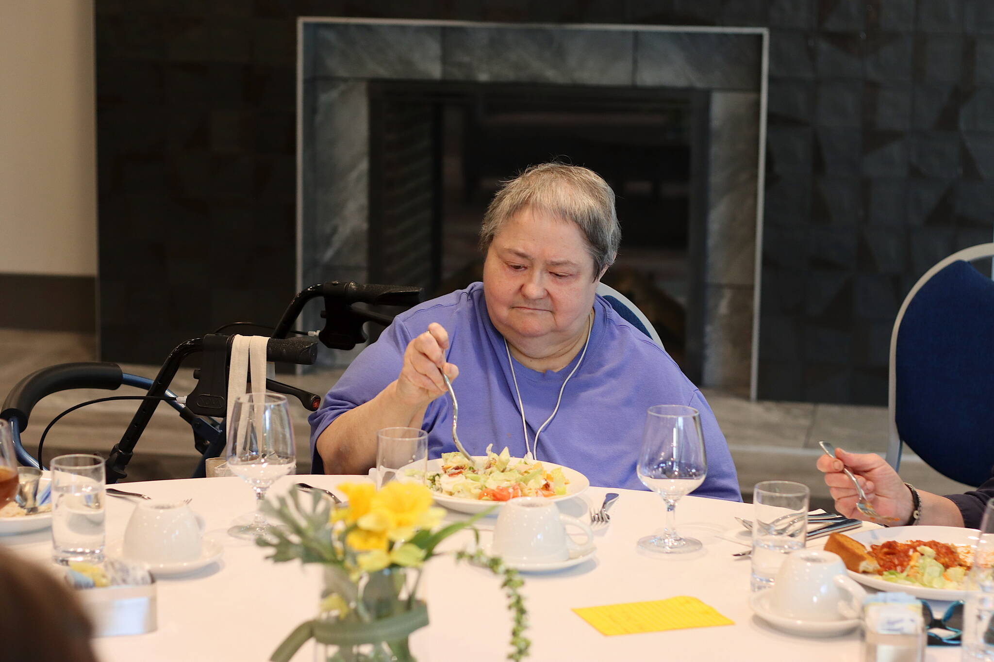 Wanda Fleming, a Juneau resident since 1973, eats dinner Wednesday with other new residents at the Riverview Senior Living complex. Fleming said she has been following the facility’s progress since she first read about it in 2021 and was among the first four residents to move in. (Mark Sabbatini / Juneau Empire)