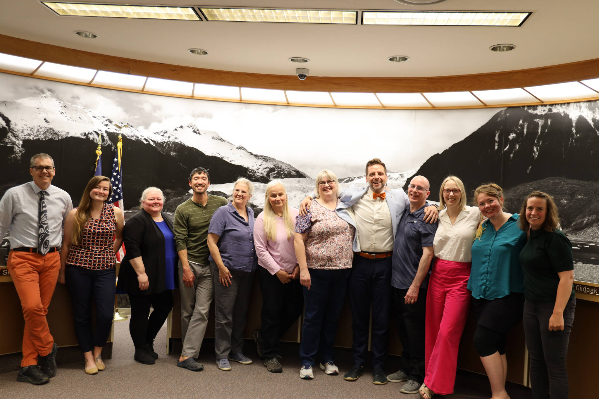 City and Borough of Juneau administration and Assembly members smile for a picture during the Finance Committee meeting Wednesday night, which was city Finance Director Jeff Rogers last finance meeting after serving four years in his position. (Clarise Larson / Juneau Empire)