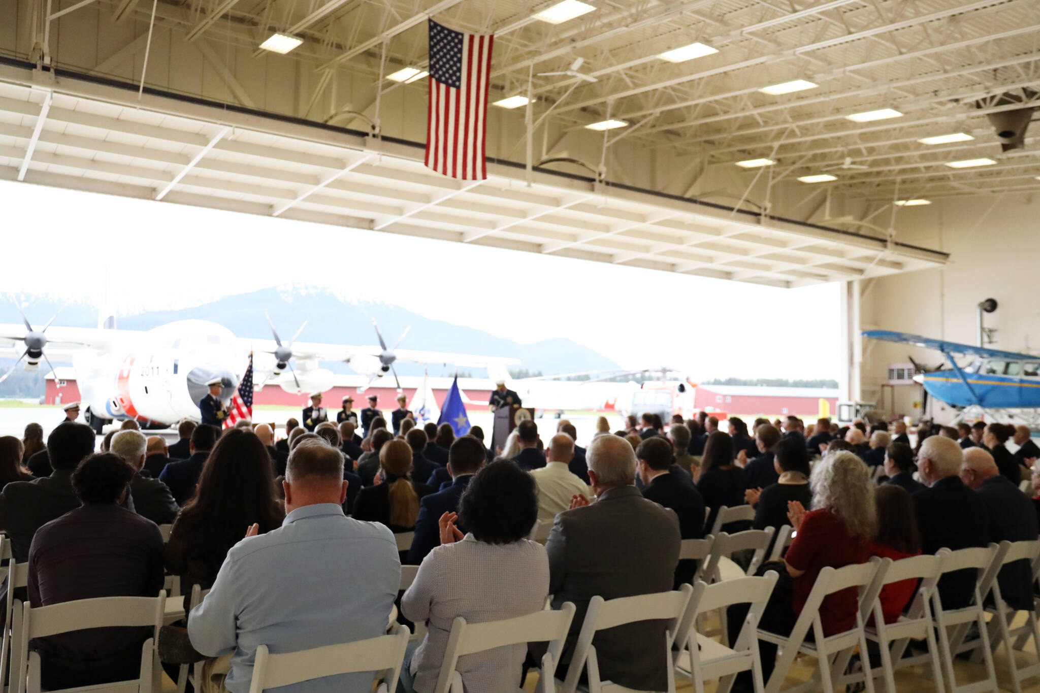 More than 100 guests including Coast Guard officials, family members and the Alaska’s Congressional Delegation attend the U.S. Coast Guard District 17 change-of-command ceremony at the Alaska Army National Guard Aviation Operating Facility in Juneau Friday morning. (Clarise Larson / Juneau Empire)