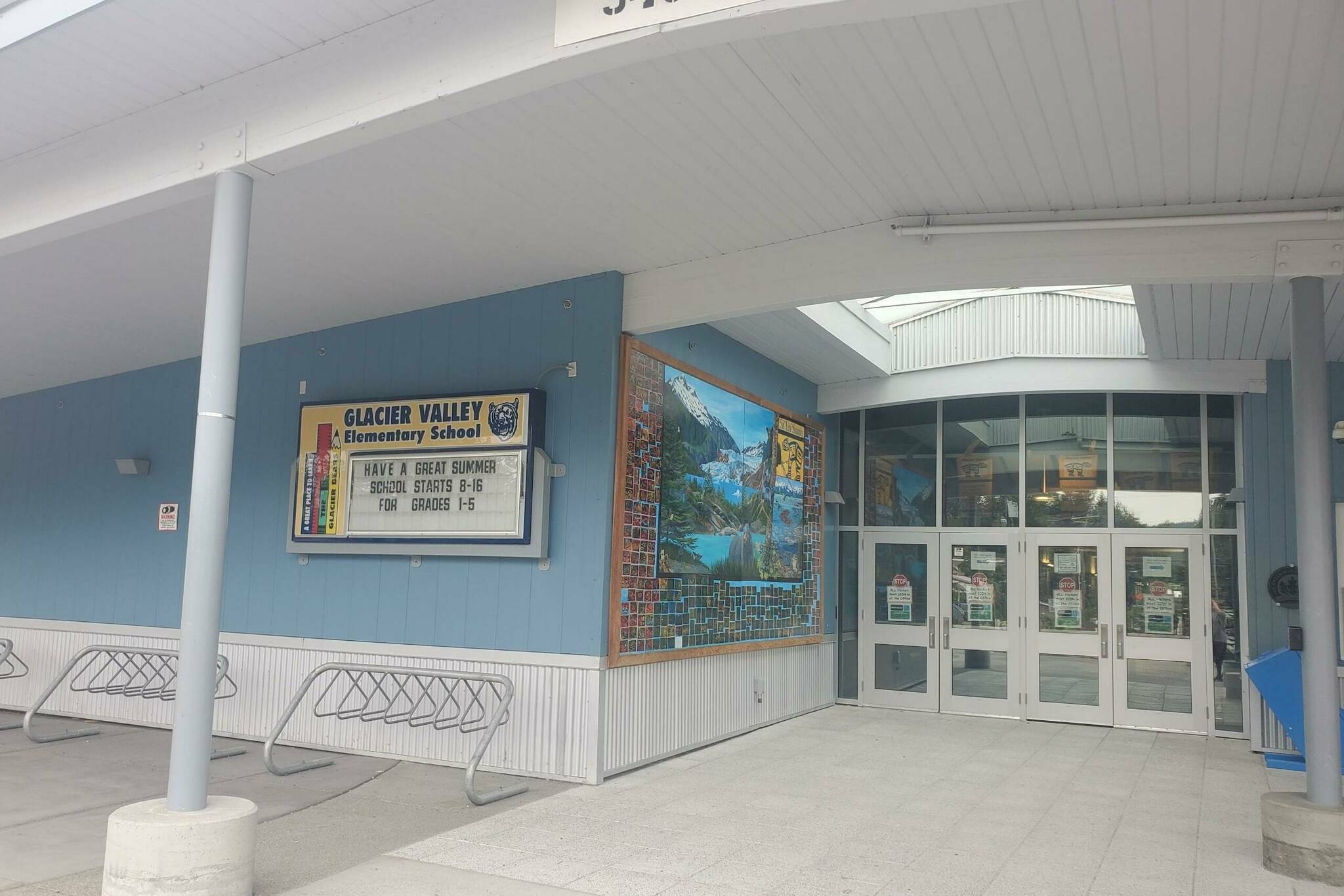 A notice about the arrival of summer is posted outside the entrance to Sitʼ Eeti Shaanáx̱ - Glacier Valley Elementary School. The schools principal told the Juneau Board of Education last Tuesday there was a 55% chronically absent rate during the past school year. (Juneau Empire File)