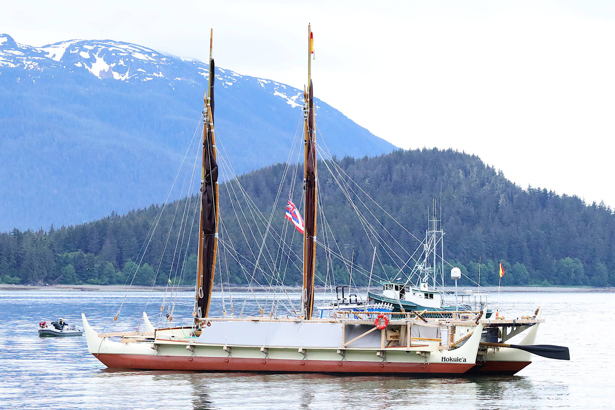 The Hōkūle‘a arrives in Auke Bay on June 11, where it was welcomed by hundreds of Juneau residents and tribal leaders. The wind-powered traditional Polynesian voyaging canoe departed Juneau at about 4:15 a.m. Sunday to begin a scheduled 47-month global voyage. The originally scheduled start of the trip was delayed from Thursday due to poor weather. (Clarise Larson / Juneau Empire)