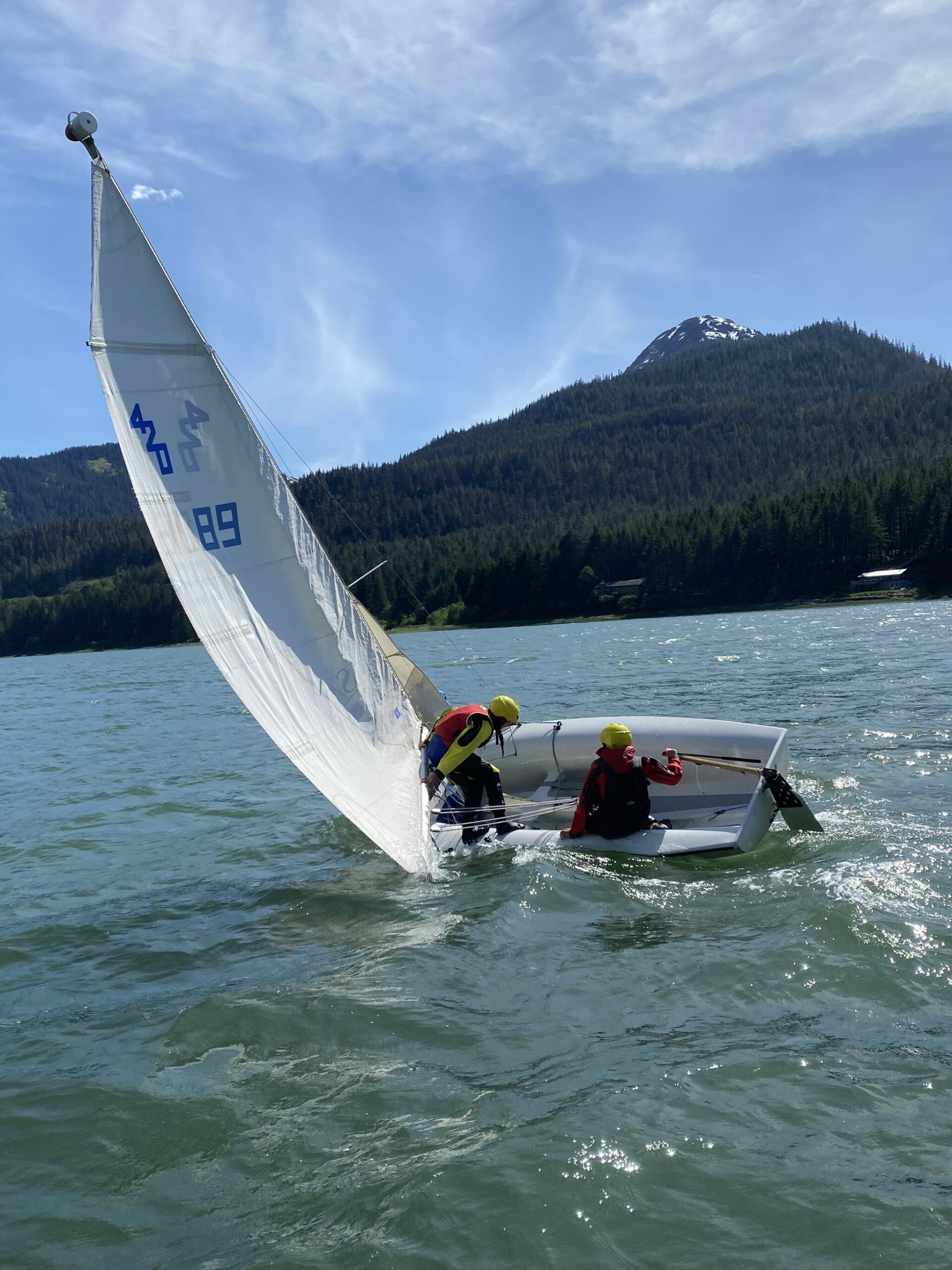 Lua Mangaccat, 15, and Jack Adams, 15, try right their boat during a Juneau Youth Sailing course this week. (Photo by Adrian Whitney)