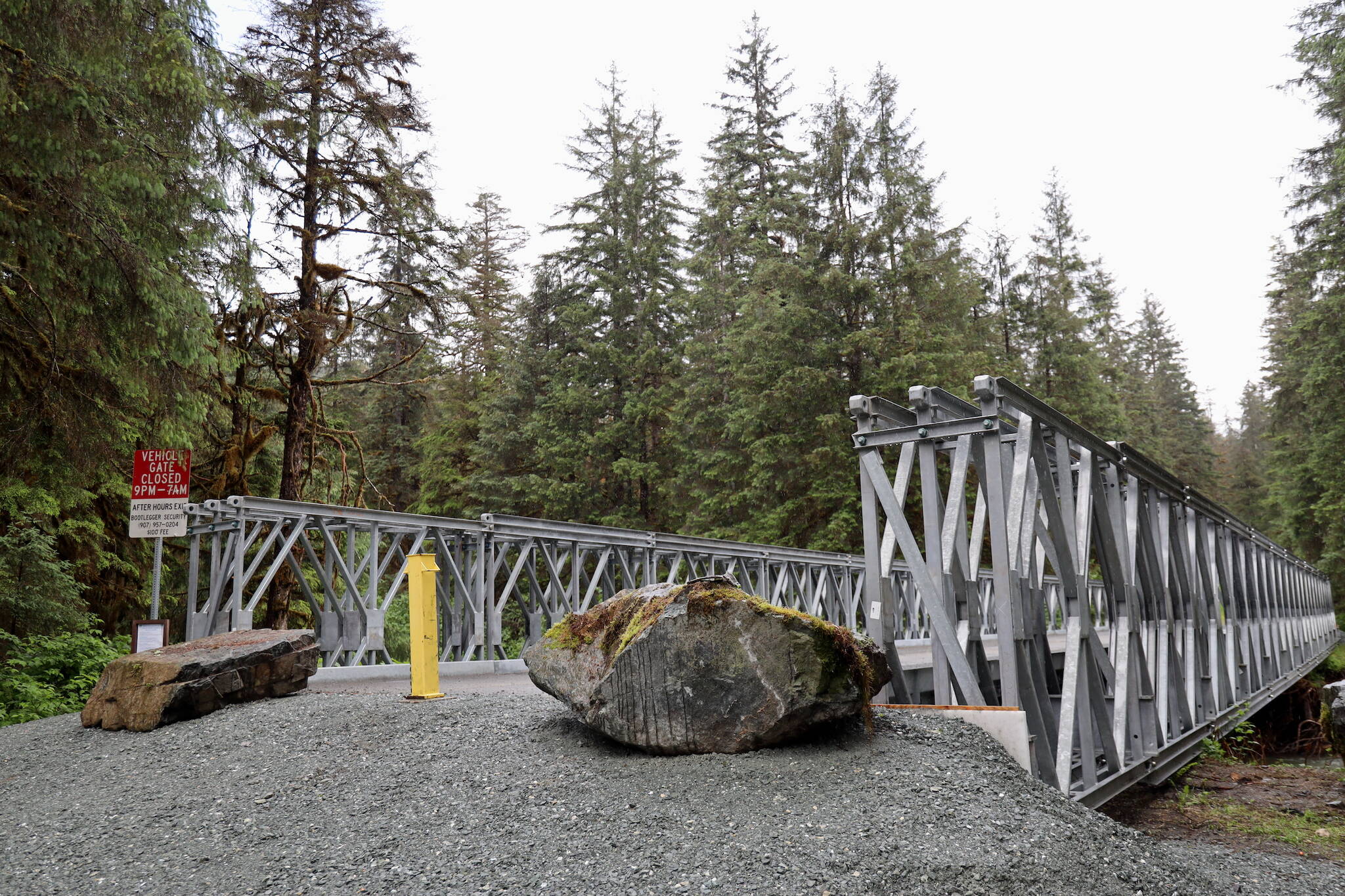 A temporary pedestrian bridge over Montana Creek, seen here Thursday, is now open as a replacement for the bridge that suffered substructure damage from weather events last September. (Clarise Larson / Juneau Empire)