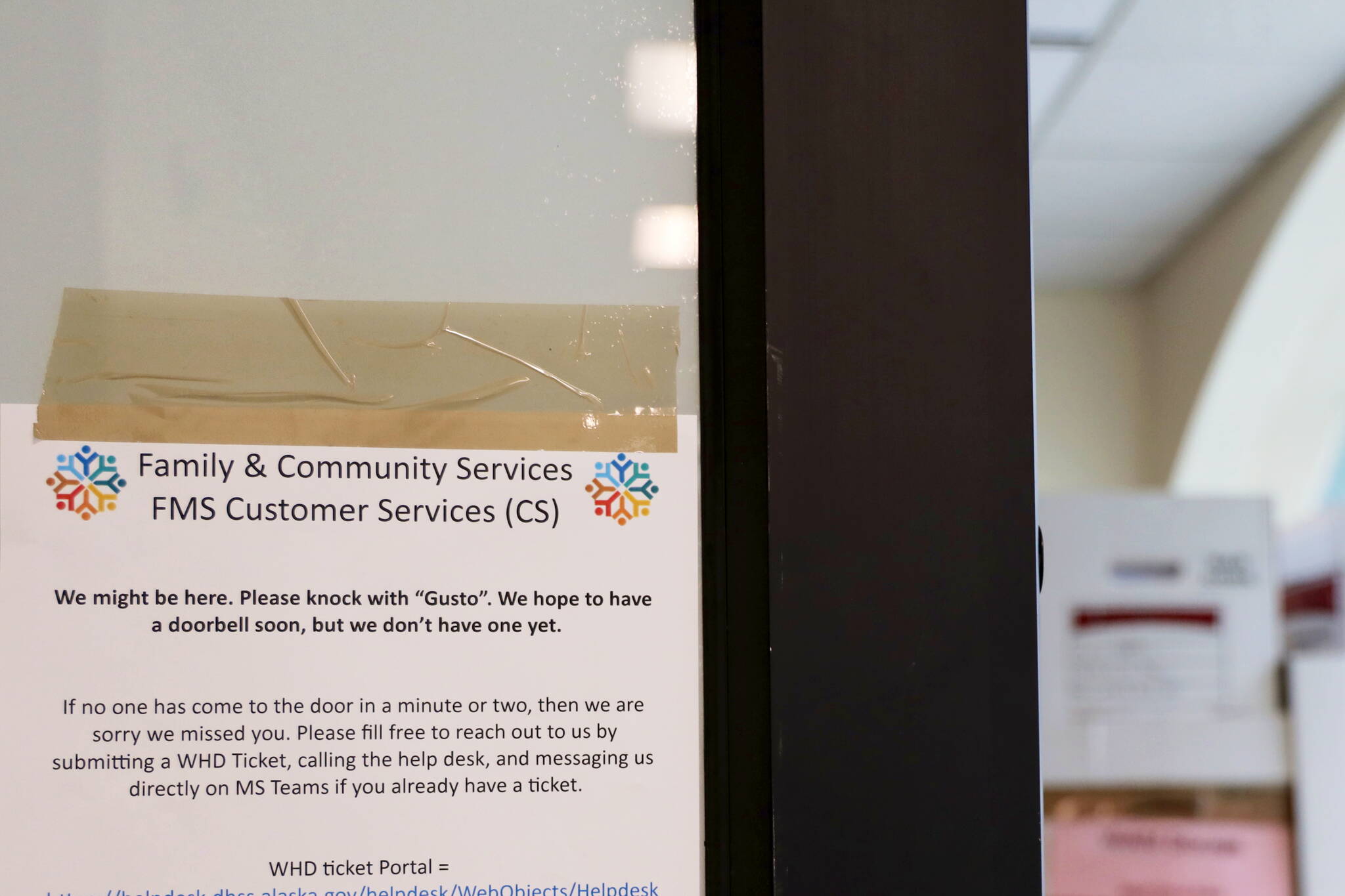 A makeshift sign offers instructions for people visiting an Alaska Department of Family and Community Services office in Juneau on June 28. The department officially formed a year ago, when the Department of Health and Social Services was split in two, has been subject to criticism by federal investigators as well as Alaska residents relying on the department’s services during the past year. (Clarise Larson / Juneau Empire)