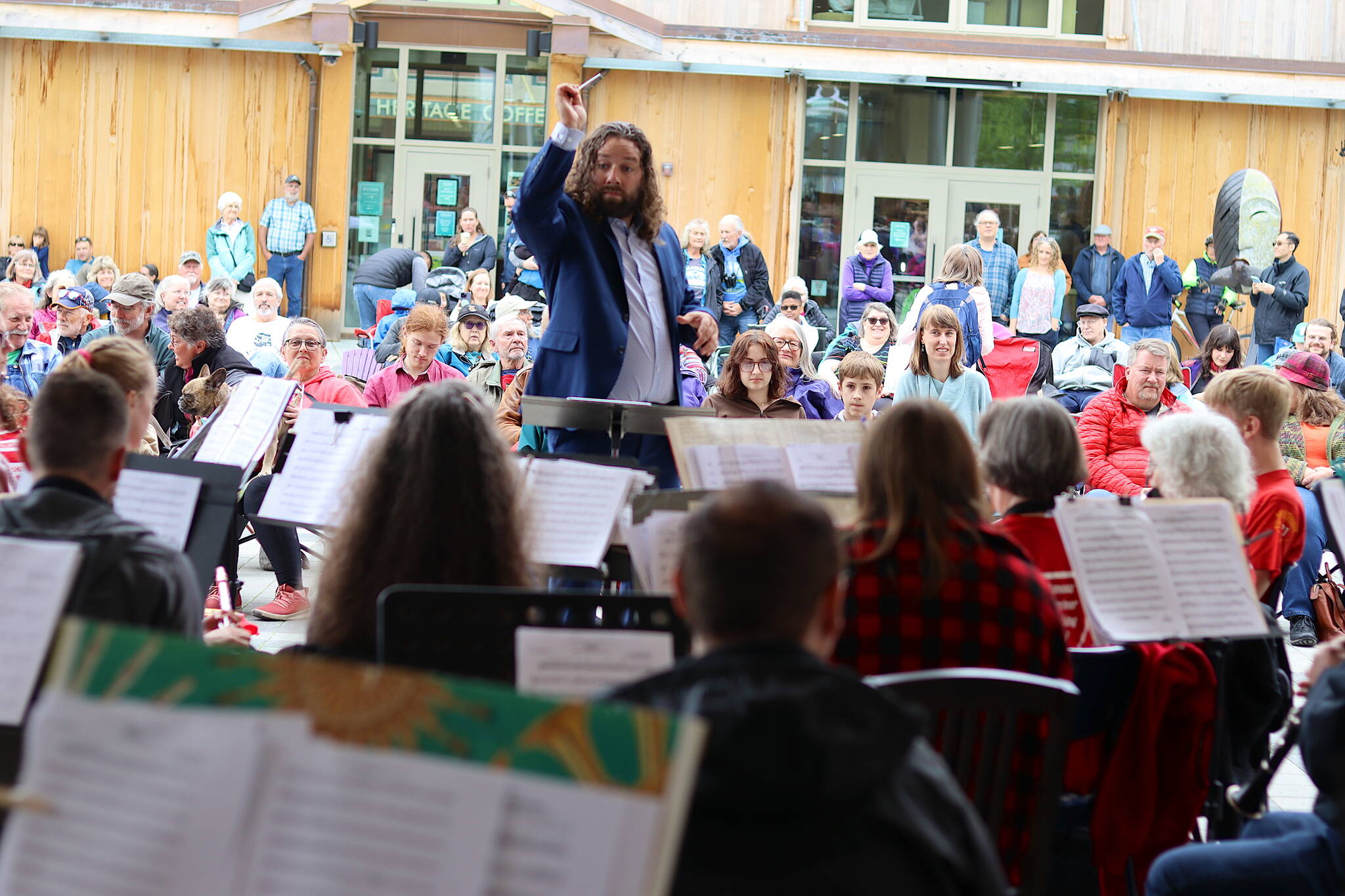 T.J. Hovest conducts the Juneau Volunteer Marching Band during an Independence Day weekend concert on Sunday at Sealaska Heritage Plaza. (Mark Sabbatini / Juneau Empire)