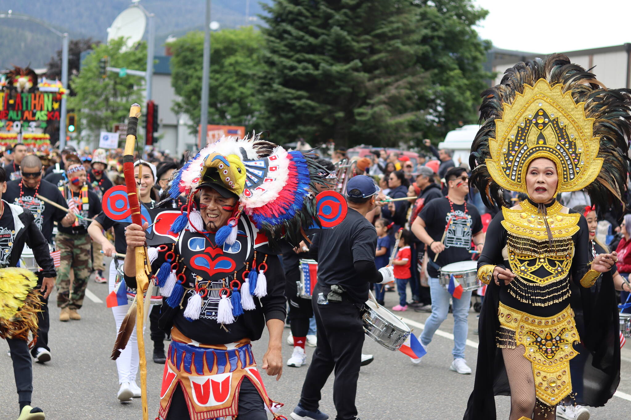 The Ati-Atihan Juneau Group proceeds down Egan Drive during Juneau’s annual Fourth of July parade on Tuesday. The group won the top overall prize among parade participants. (Mark Sabbatini / Juneau Empire)