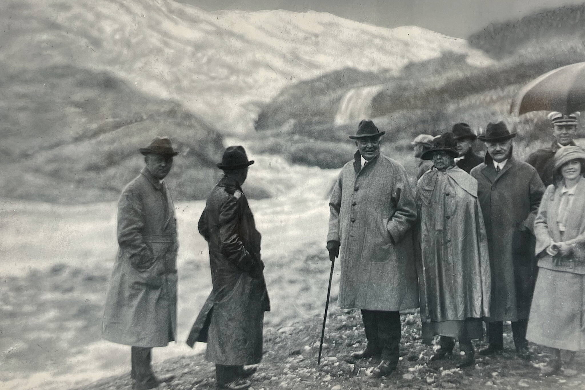 Alaska State Library Historical Collection P418-3
President Warren G. Harding (with walking stick) stands beside his wife (in cape) before Mendenhall Glacier on July 10, 1923. To Mrs. Harding’s side is Alaska Territorial Gov. Scott Bone (with mustache) and his niece Marguerite Bone.