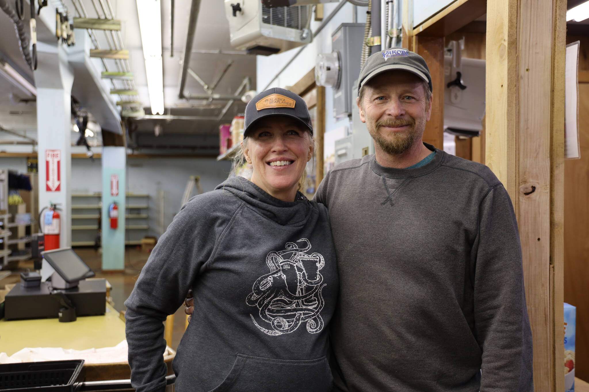 Barry and Heather Bryant smile for a photo in their newly opened Pelican General store on Monday afternoon. The store is the town’s first general store to open in 15 years. (Clarise Larson / Juneau Empire)