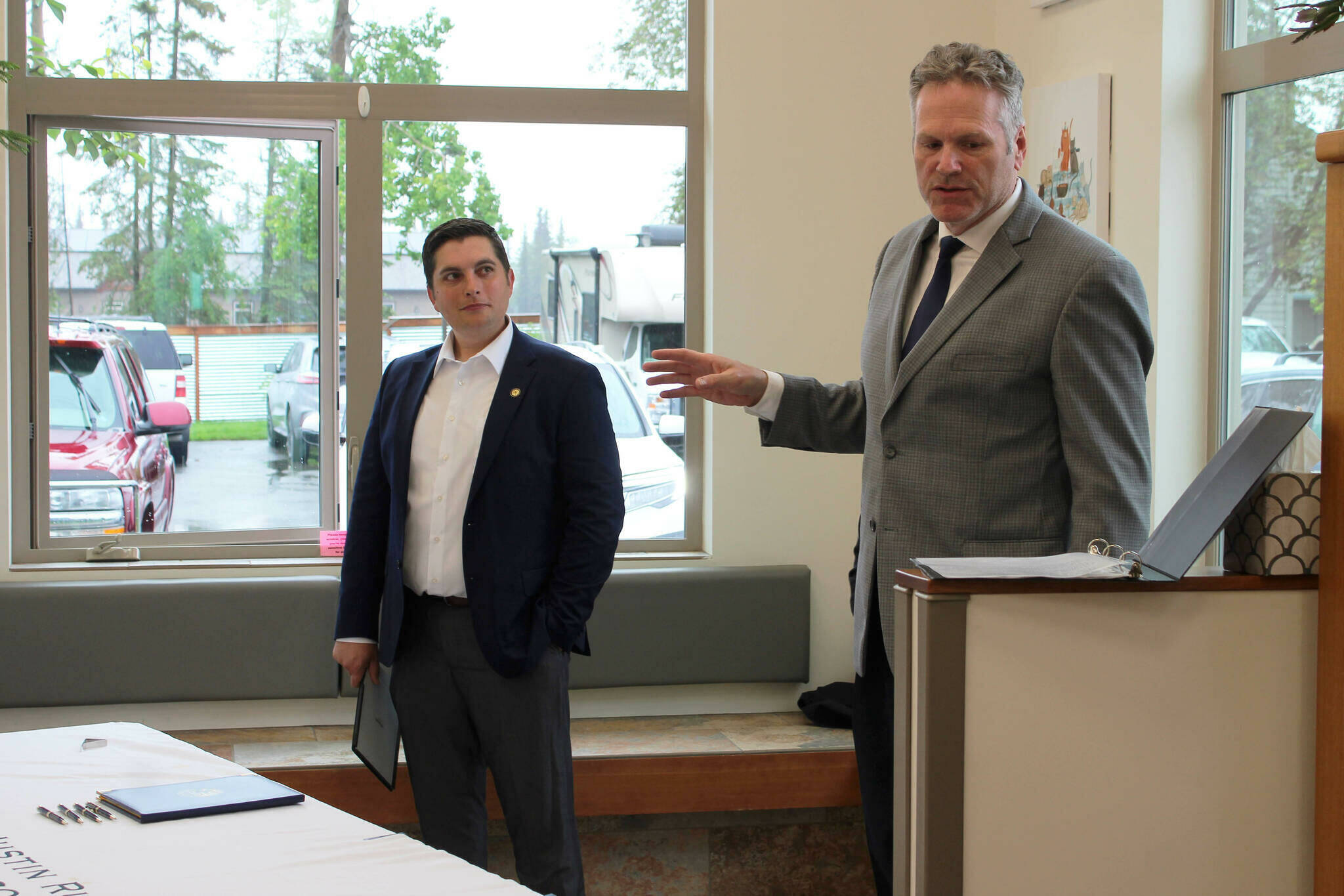 Gov. Mike Dunleavy (right) delivers opening remarks at a bill signing event at Twin Cities Veterinary Clinic on Thursday in Soldotna. (Ashlyn O’Hara/Peninsula Clarion)