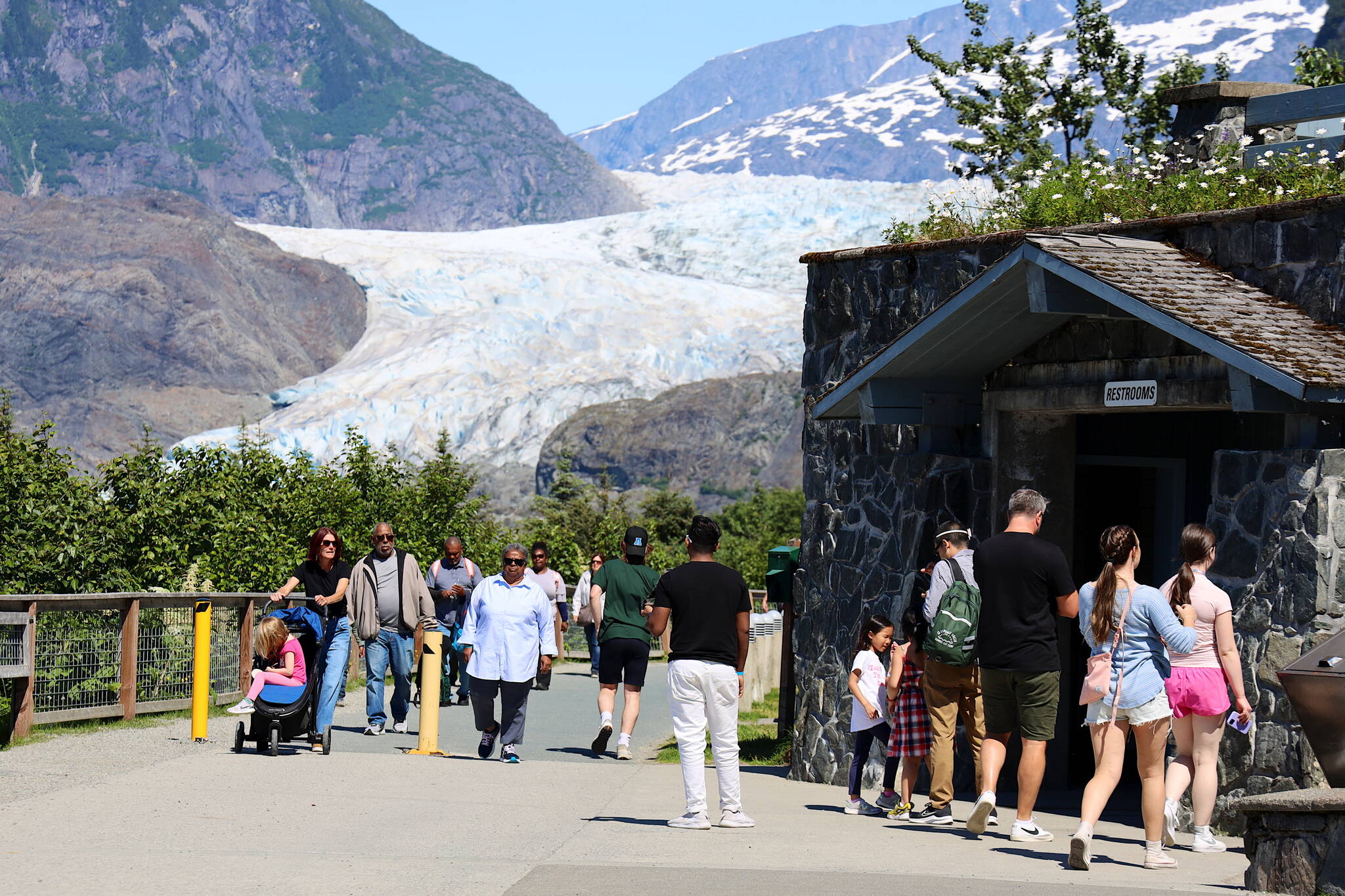 Clarise Larson / Juneau Empire
A crowd of visitors tours the Mendenhall Glacier on Friday. Officials announced Friday limits on commercial tours are being imposed as capacity limits are being rapidly reached, which will impact the second half of the summer tourism season. A plan by the U.S. Forest Service to overhaul the facilities of the Mendenhall Glacier Recreation Area is now in the final stages, which would replace the existing capacity limits with newly defined management practices.