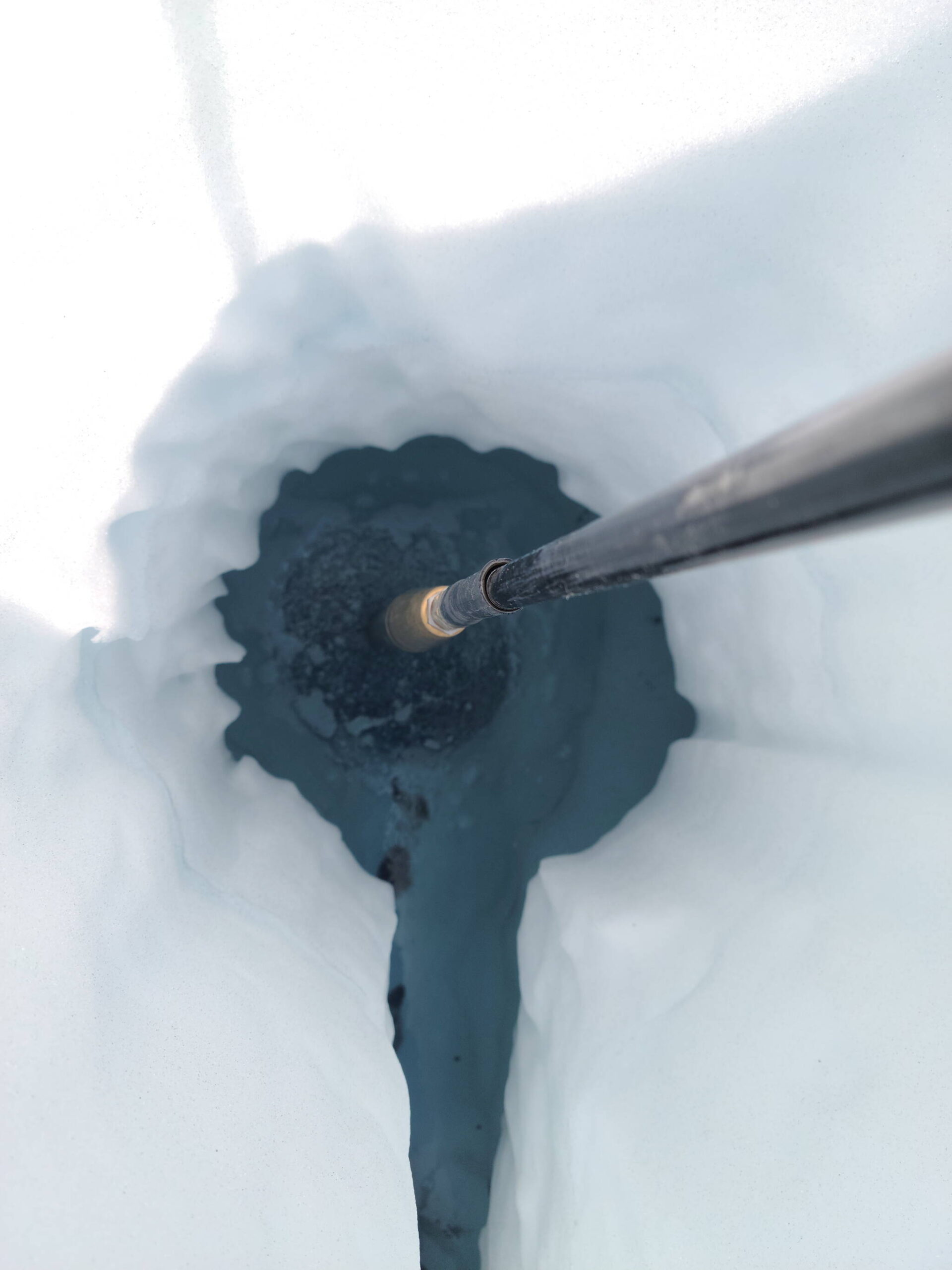 A drill penetrates well below the surface of the Juneau Icefield as researchers study water hundreds of meters beneath earlier this month. (Photo courtesy of Jacob Holmes)