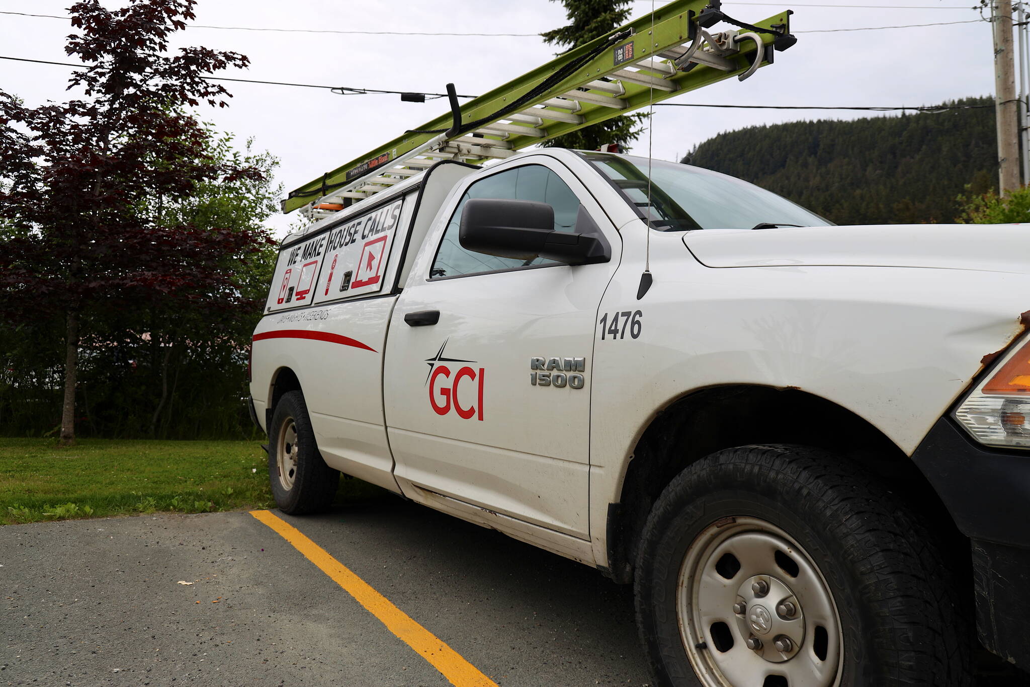 A GCI Communications truck is parked at the company’s Juneau office on Wednesday. The company’s landline service suffered outages in recent days that the company said were fixed as of Tuesday. (Clarise Larson / Juneau Empire)