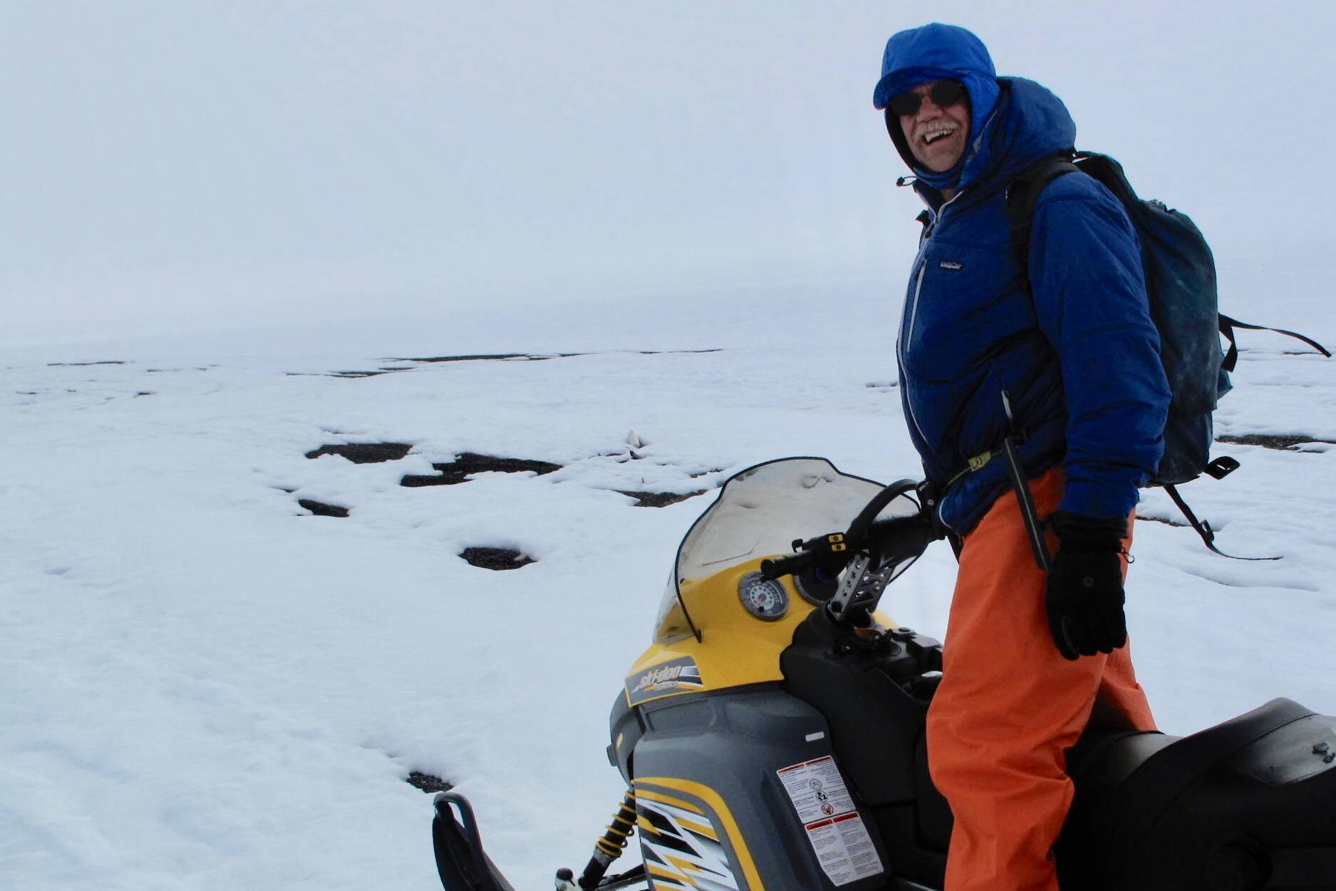 Craig George leads Ned Rozell on a snowmachine trail north of Utqiagvik in May 2010. (Photo by Ned Rozell)
