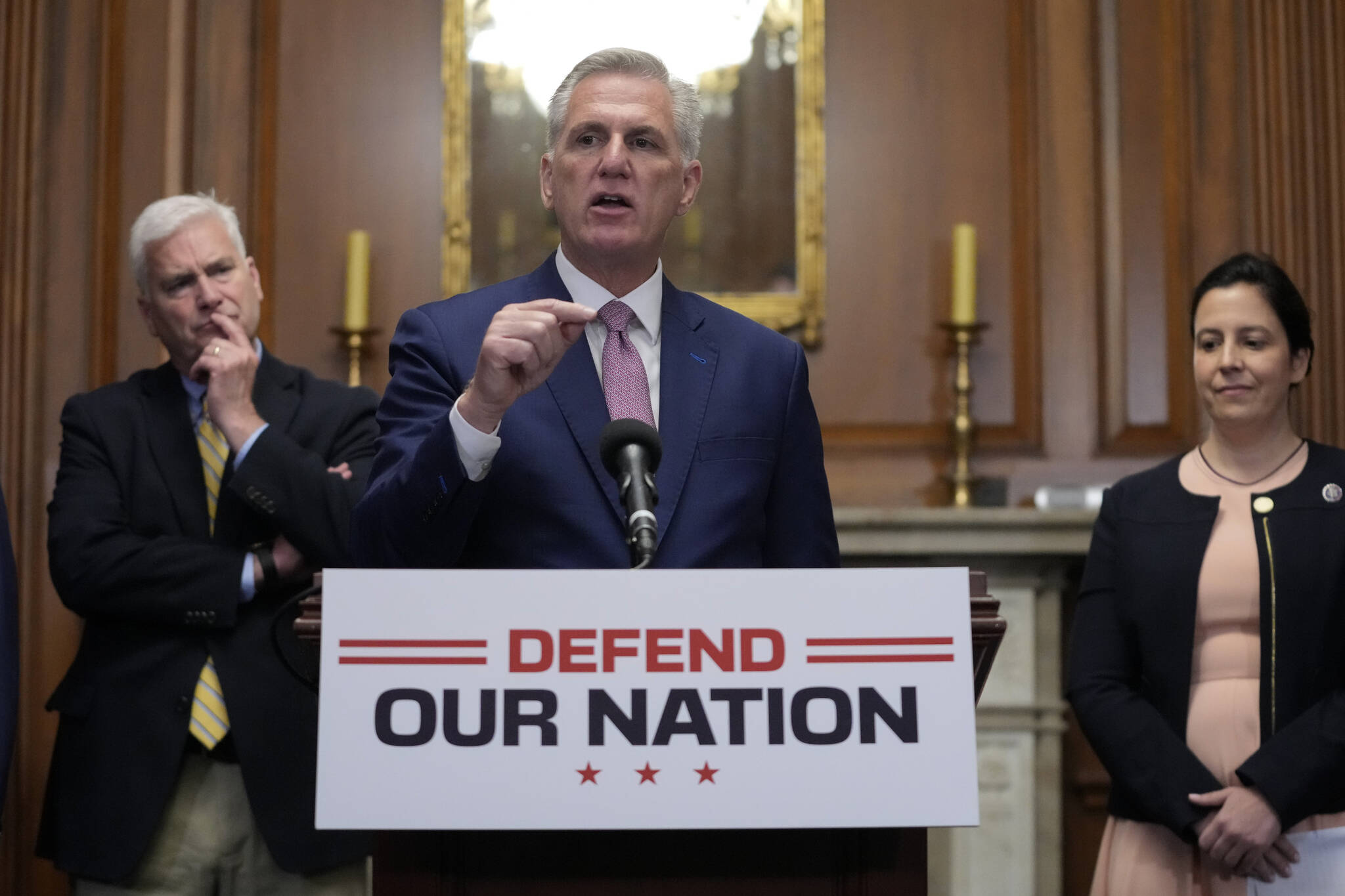 House Speaker Kevin McCarthy of Calif., speaks during a news conference after the House approved an annual defense bill, Friday, July 14, 2023, on Capitol Hill in Washington. Standing behind McCarthy are House Majority Whip Tom Emmer, R-Minn., left, and House Republican Conference Chair Elise Stefanik, R-N.Y. (AP Photo/Patrick Semansky)