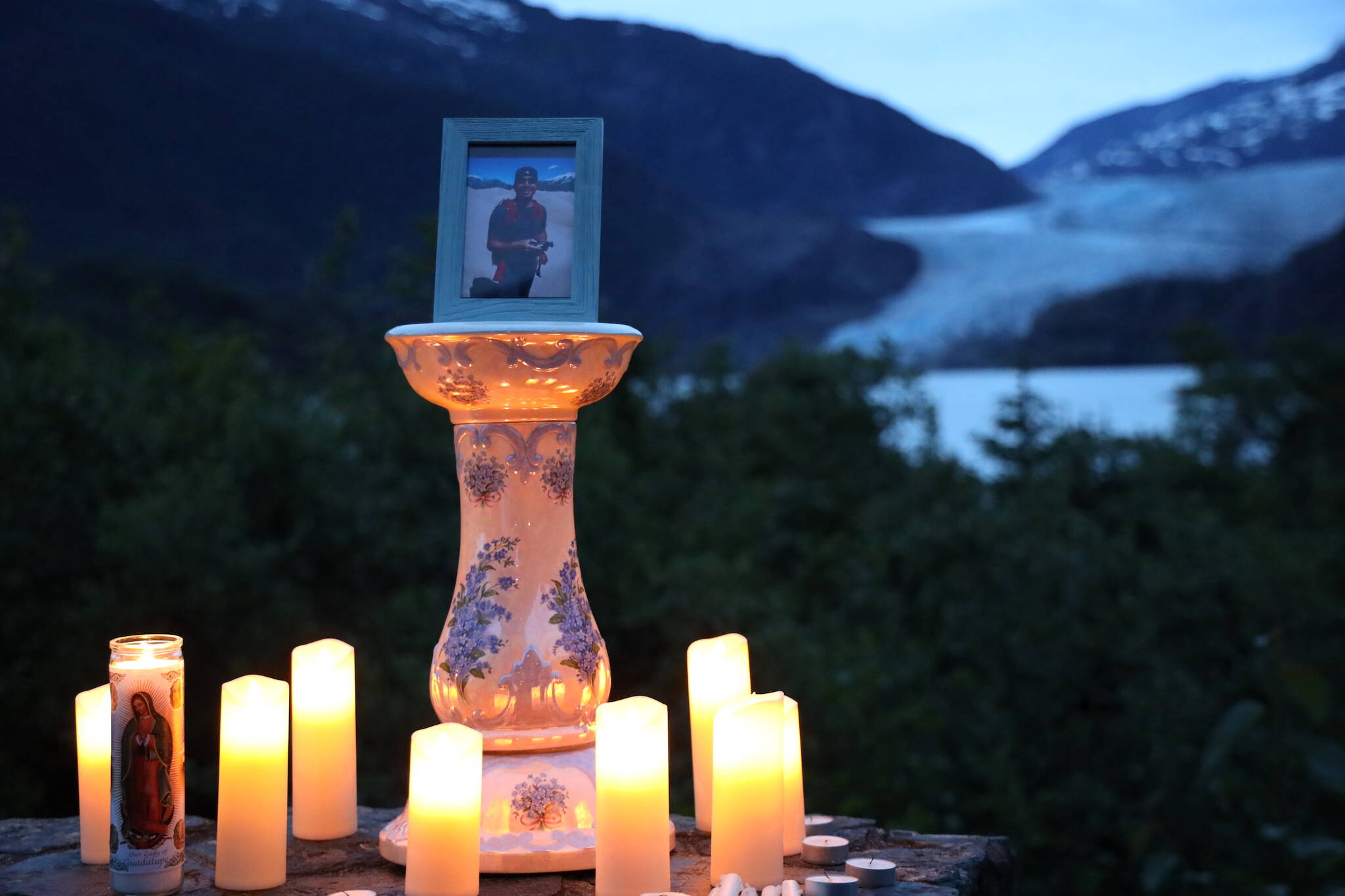 A candlelit vigil was held at the Mendenhall Glacier Visitor Center to honor Paul Rodriguez Jr., pictured, who drowned while kayaking on Mendenhall Lake last week. (Clarise Larson / Juneau Empire)