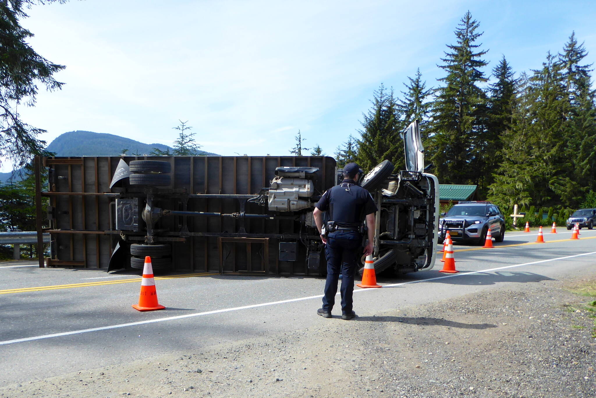 A moving truck that overturned blocks Fritz Cove Road in both directions Thursday. Nobody was injured by the accident, but traffic is being diverted to Engineers Cutoff Road, according to the Juneau Police Department. (Photo by Judy Hutchison)