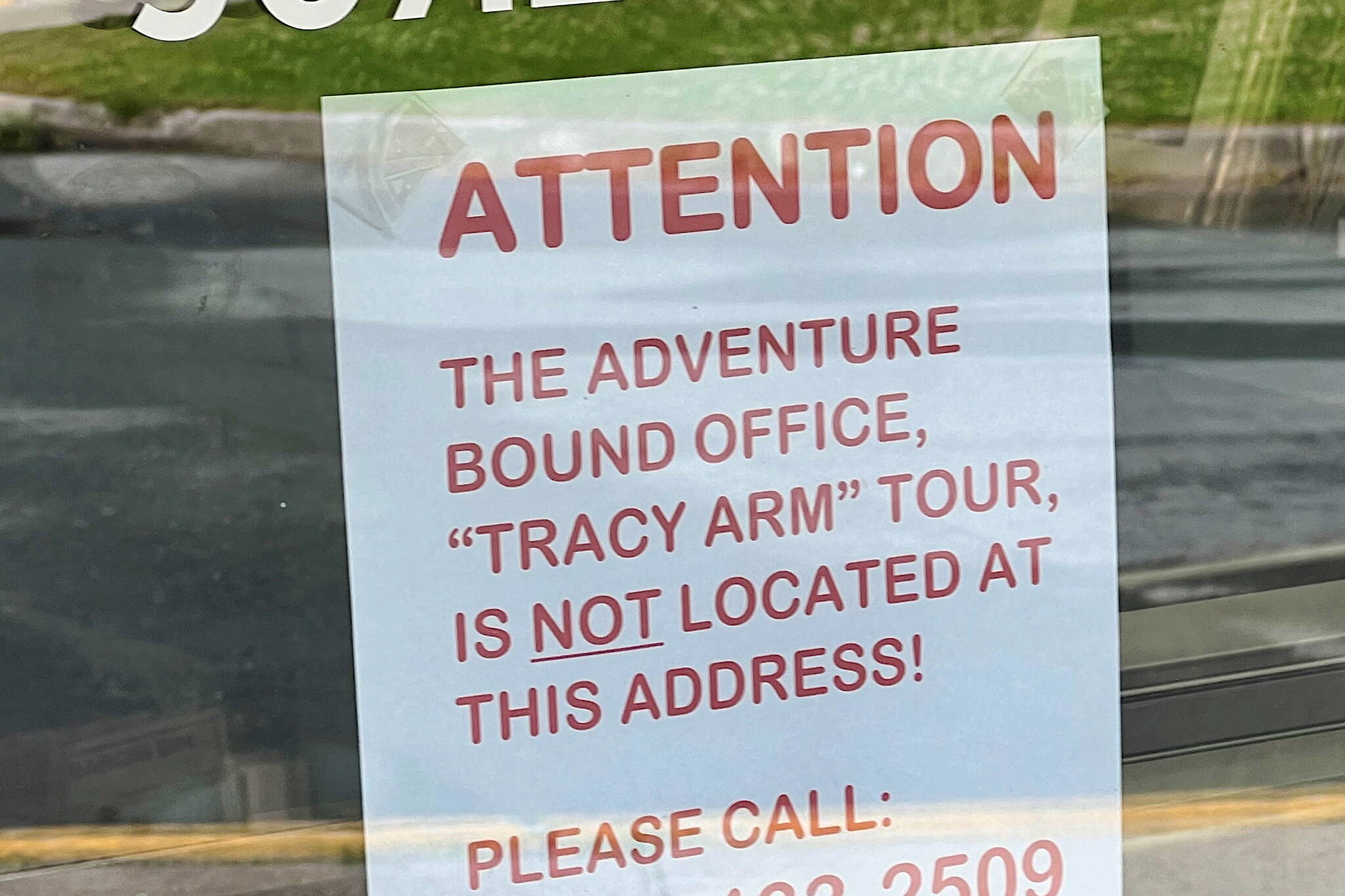 A sign at a Juneau business alerts people searching for Adventure Bound Alaska that the tour company is no longer at an address listed at the company’s website. (Meredith Jordan / Juneau Empire)
