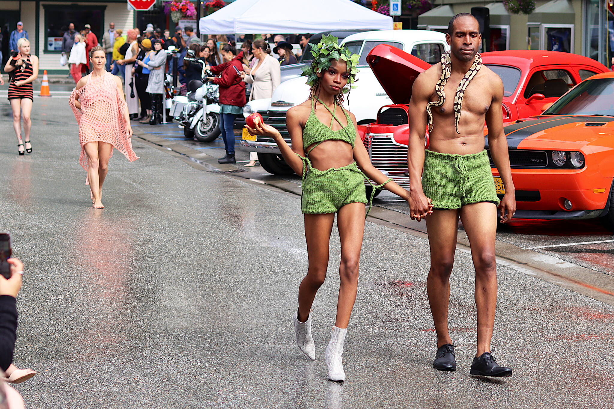 Chameleon Cooper-Lykes, left, and Demetrius Lykes, a Los Angeles couple, exhibit Adam and Eve outfits during Alaska Fashion Weeks outdoor runway show in downtown Juneau on Saturday. (Mark Sabbatini / Juneau Empire)
