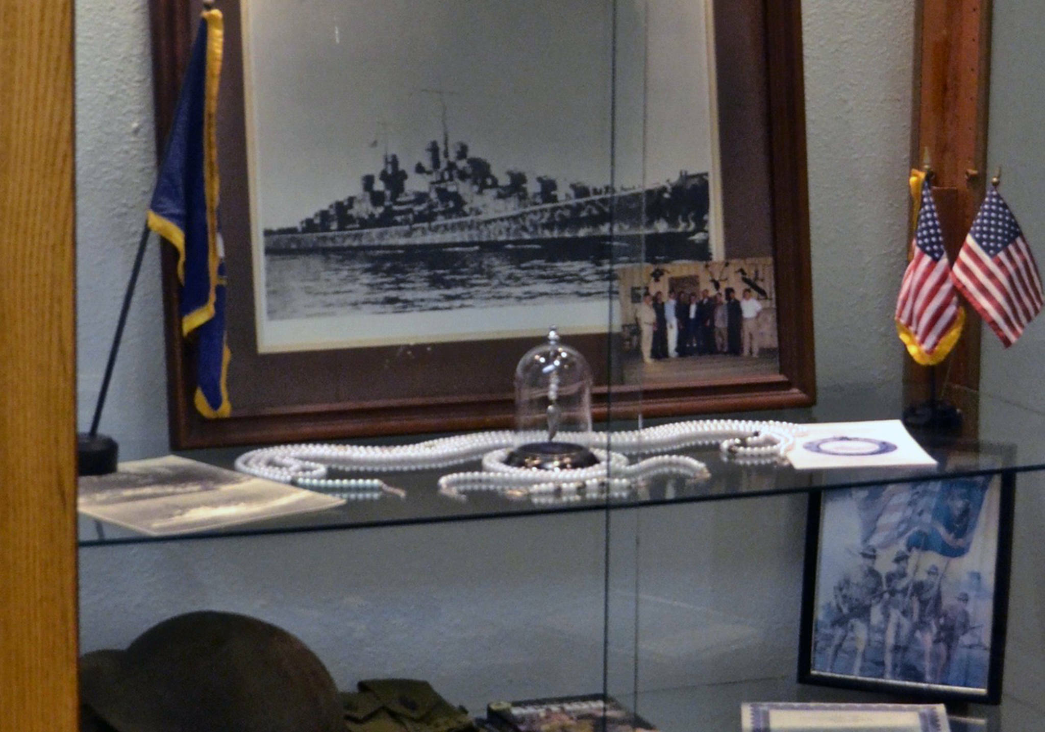 This undated photograph shows the USS Juneau memorial items that were on display at the American Legion Auke Bay Post #25 when it was burglarized in January of 2020. The long strand of beads represented those immediately killed during the torpedoing and sinking of the ship, another strand represented those who were alive and in the water, and the short strand represented those who were rescued from the water days later. The final few beads in the glass dome represented those who were still living at the time of the 75th anniversary presentation. (Courtesy photo / American Legion Auke Bay Post #25)