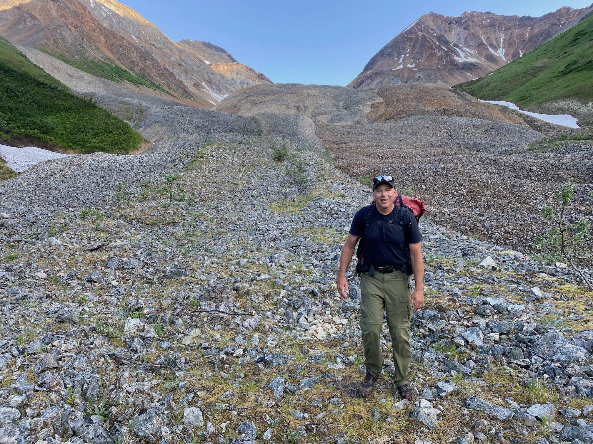 Ned Rozell walks on Fireweed rock glacier near McCarthy this month. (Photo by Adam Bucki)